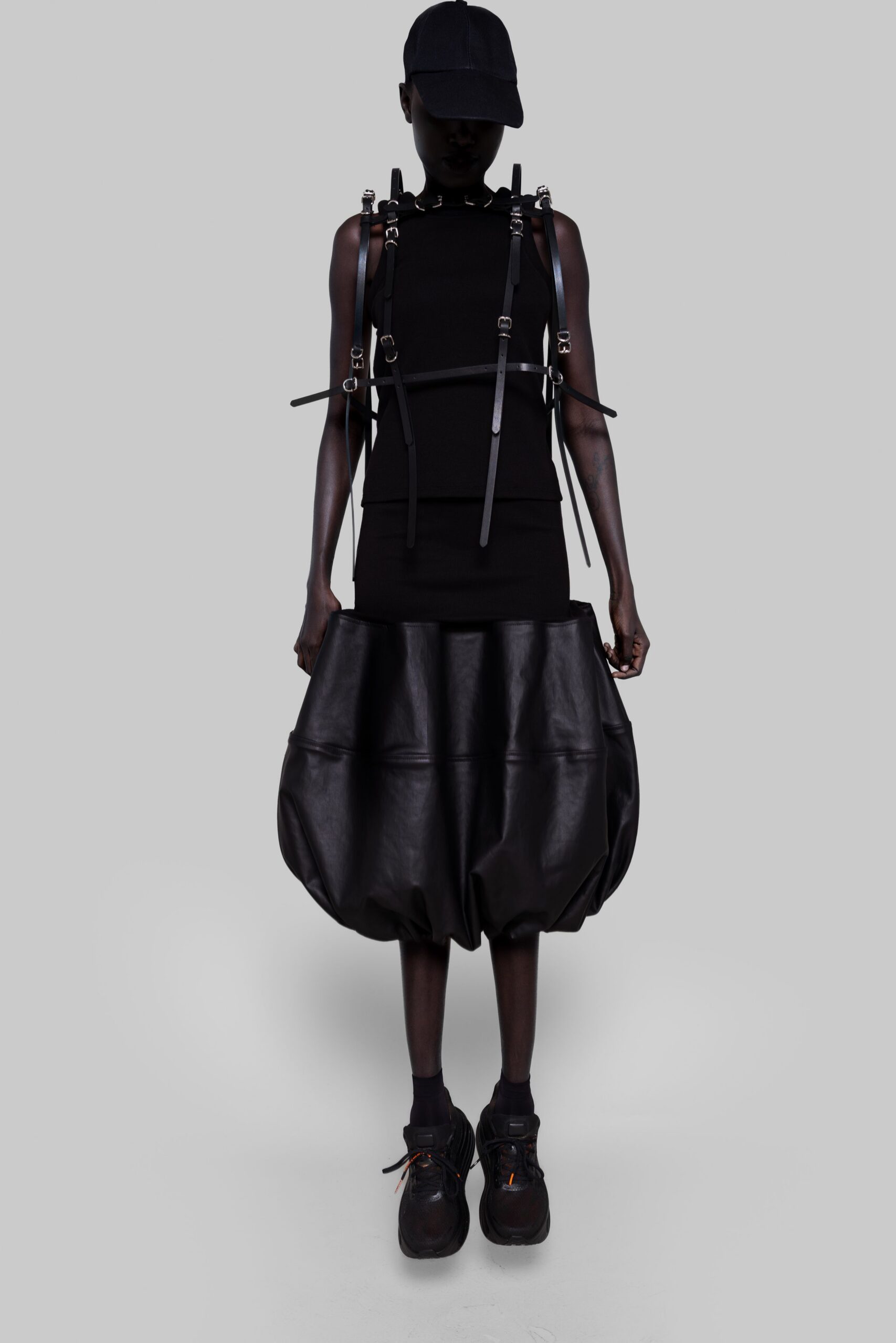 black fitted top and relaxed skirt