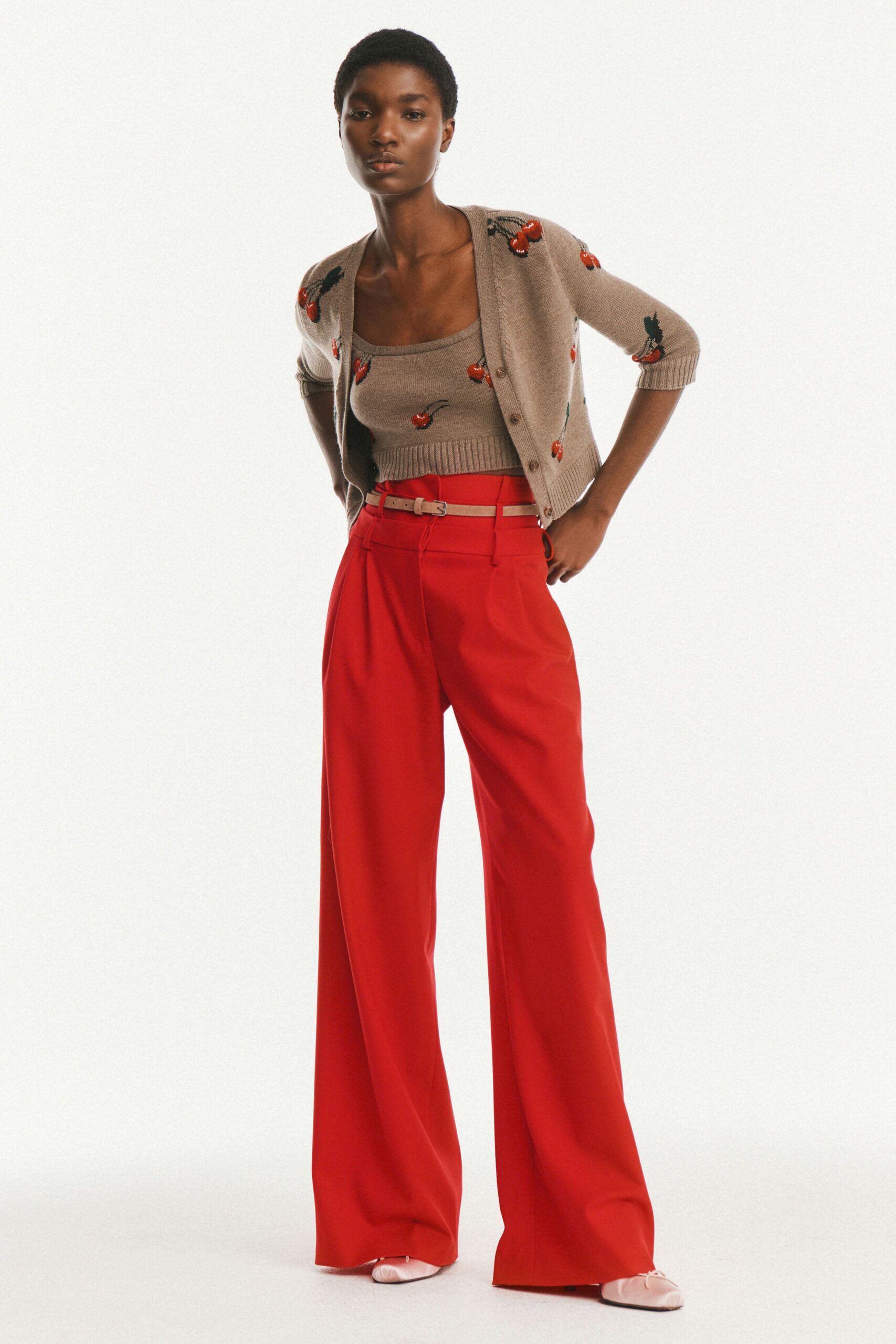 beige cardigan red tailored pants