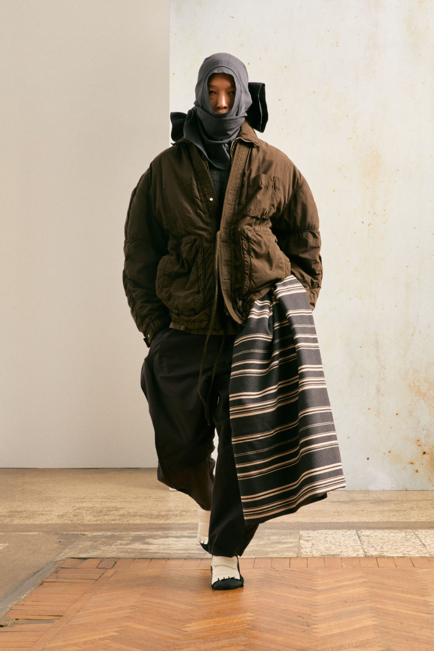 oversized brown jacket with gray hoodie
