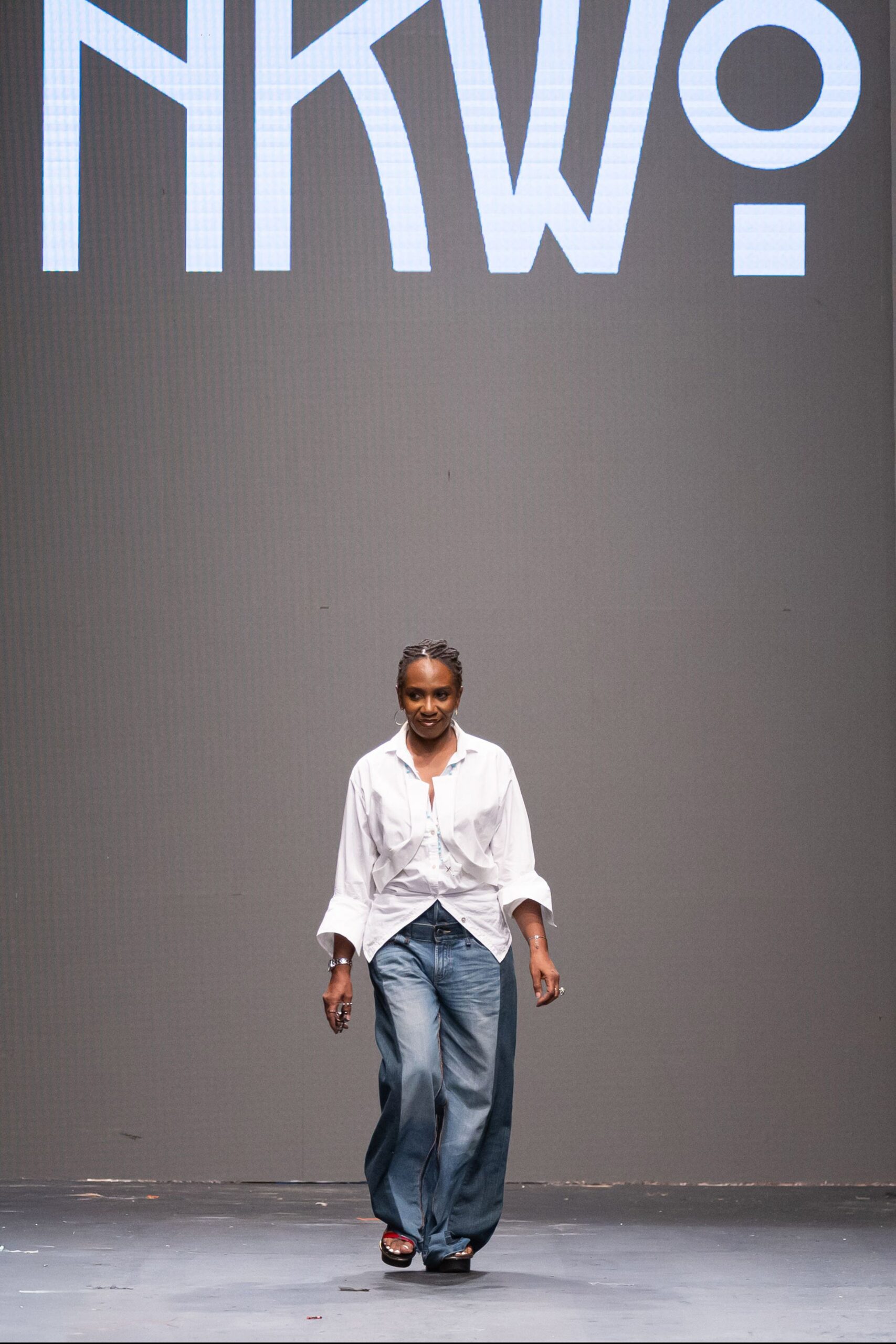 white relaxed shirt with blue denim pants