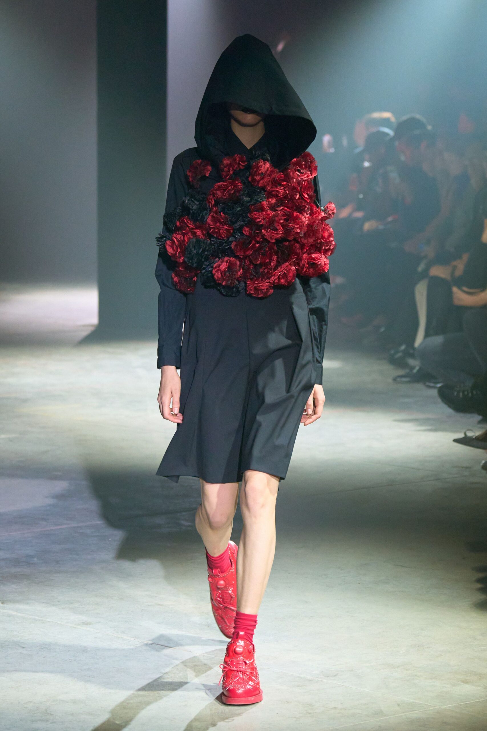 black hooded mini dress with red shoes