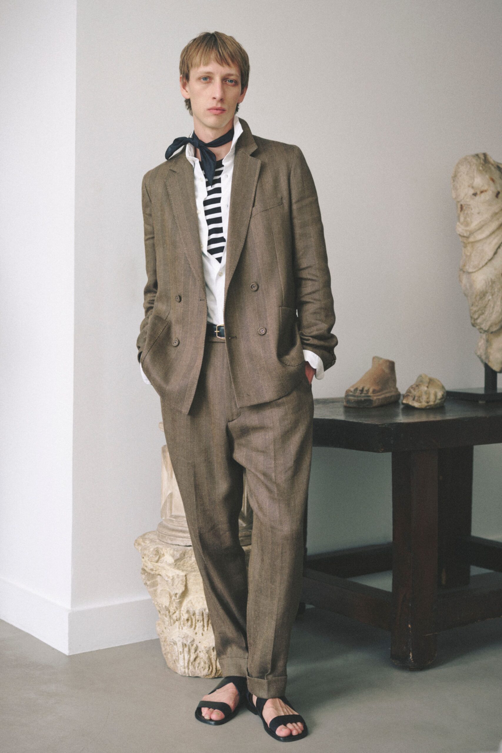 brown tailored suit with striped shirt