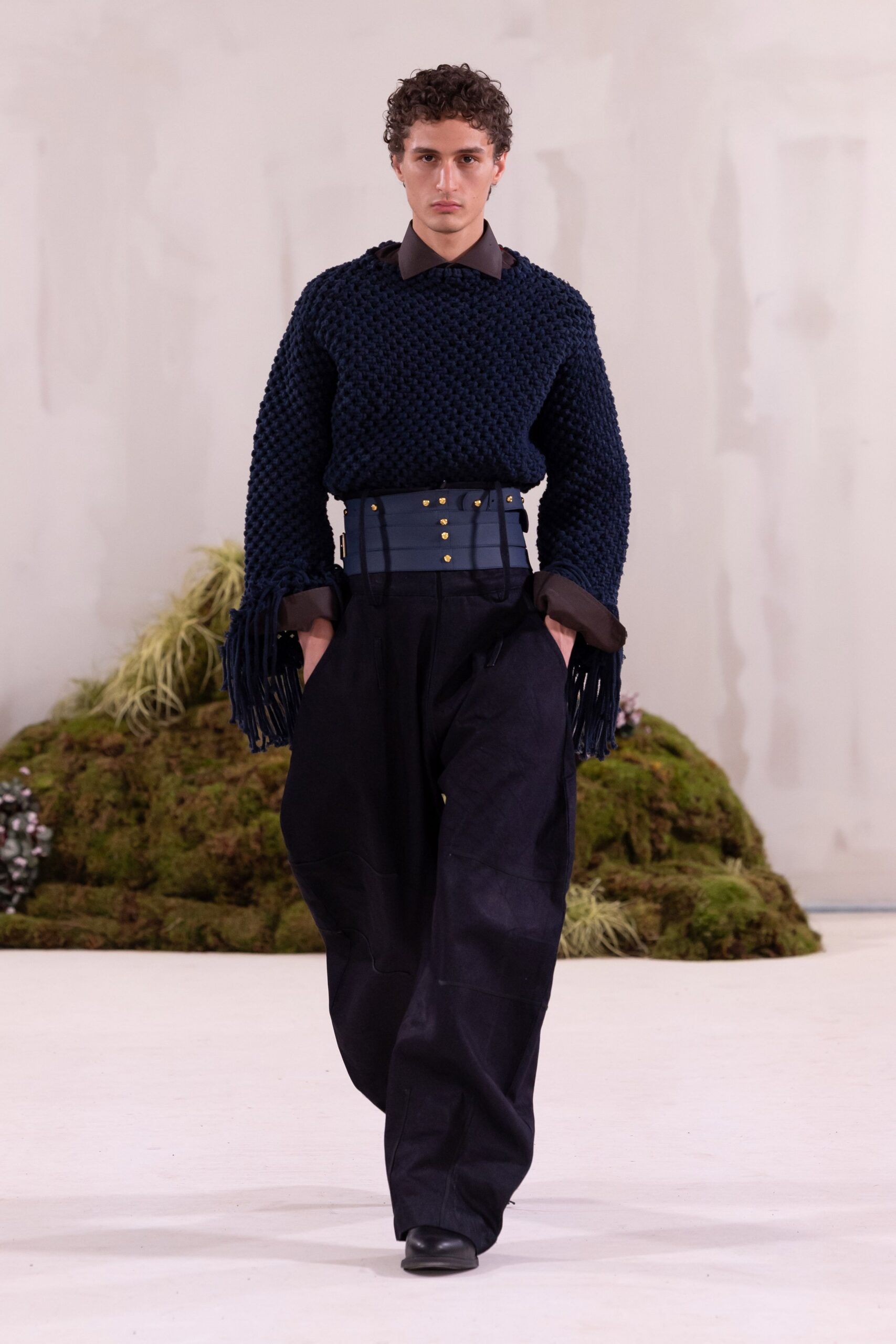blue relaxed sweater with black pants