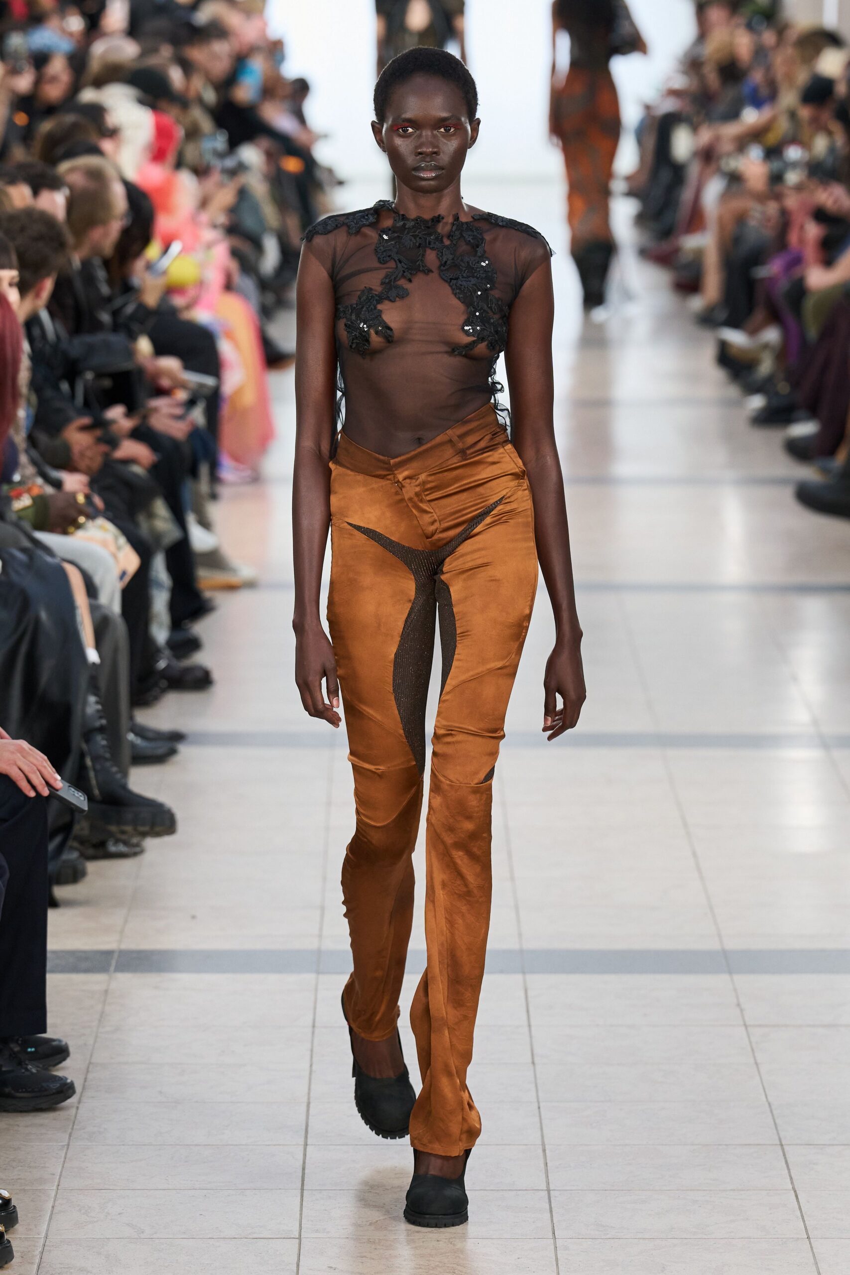 black mesh top brown fitted pants