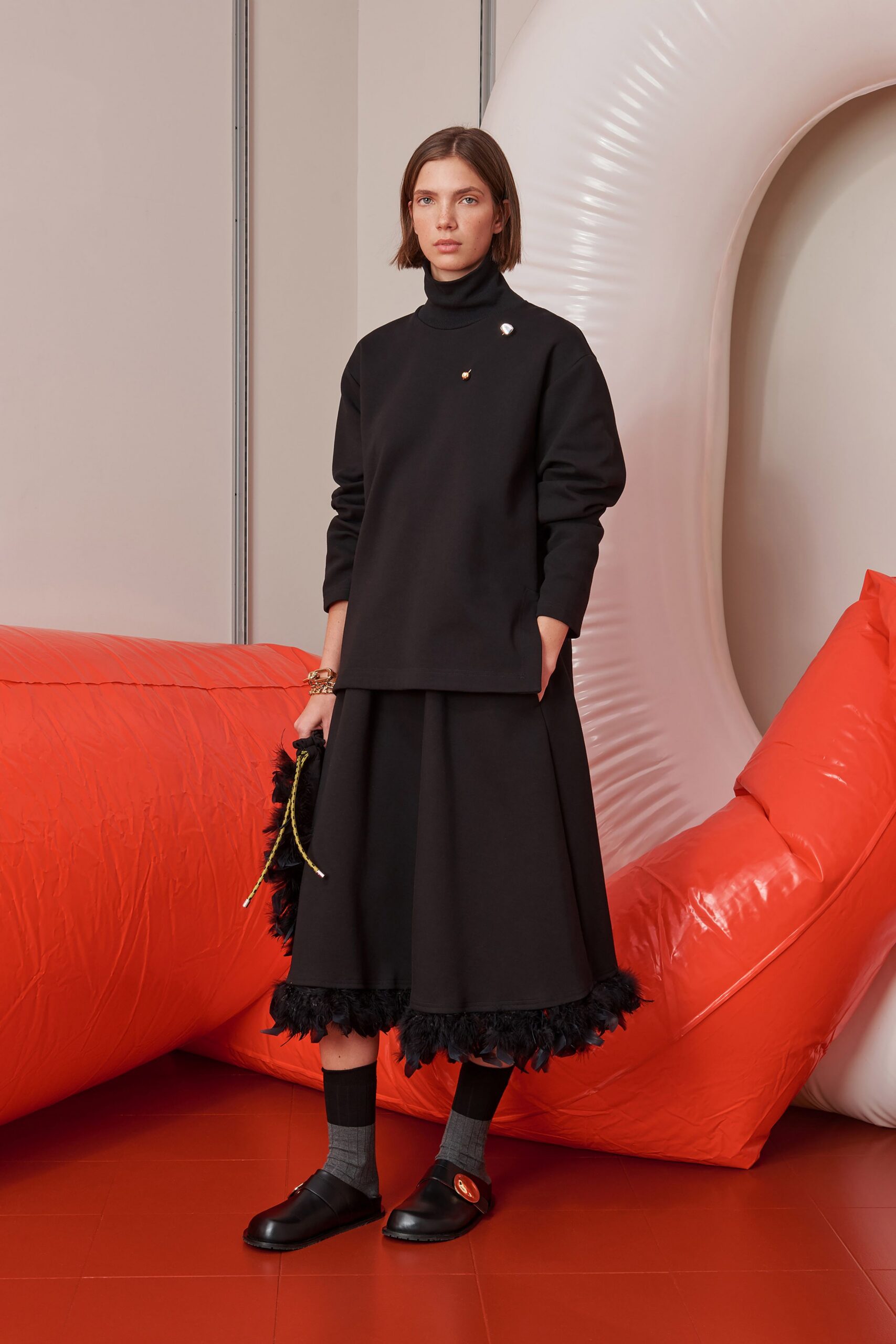 black relaxed top and midi skirt