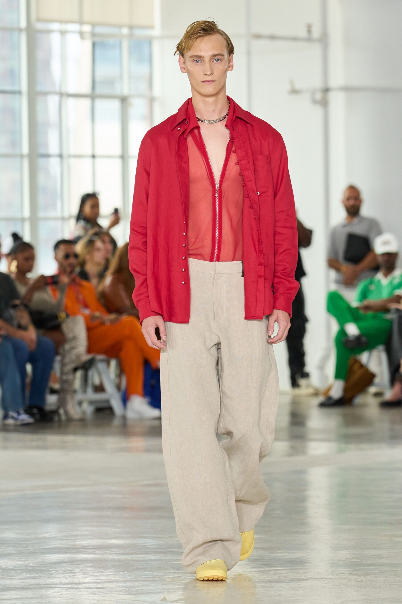 red shirt beige pants yellow shoes