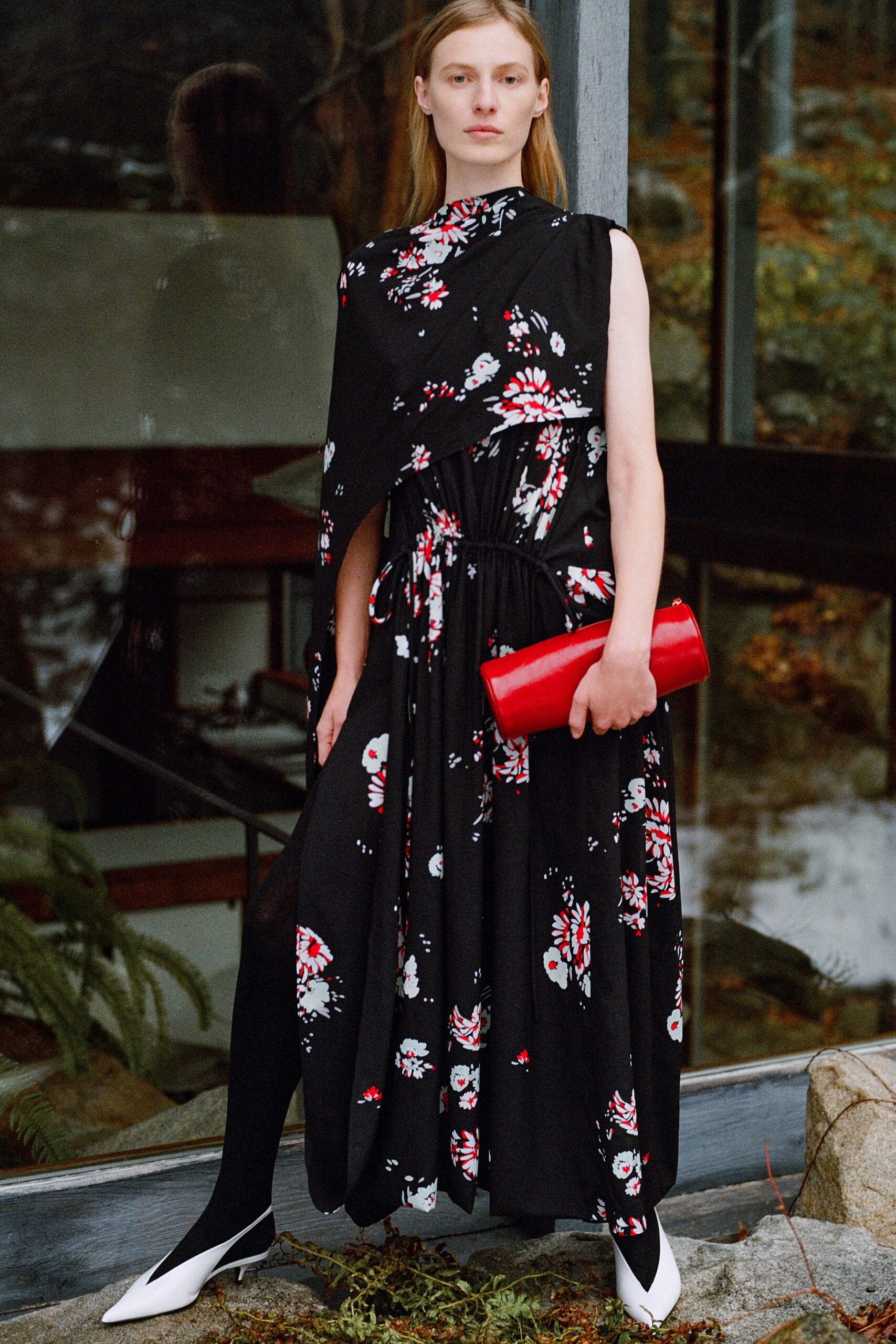 black floral maxi dress with red clutch