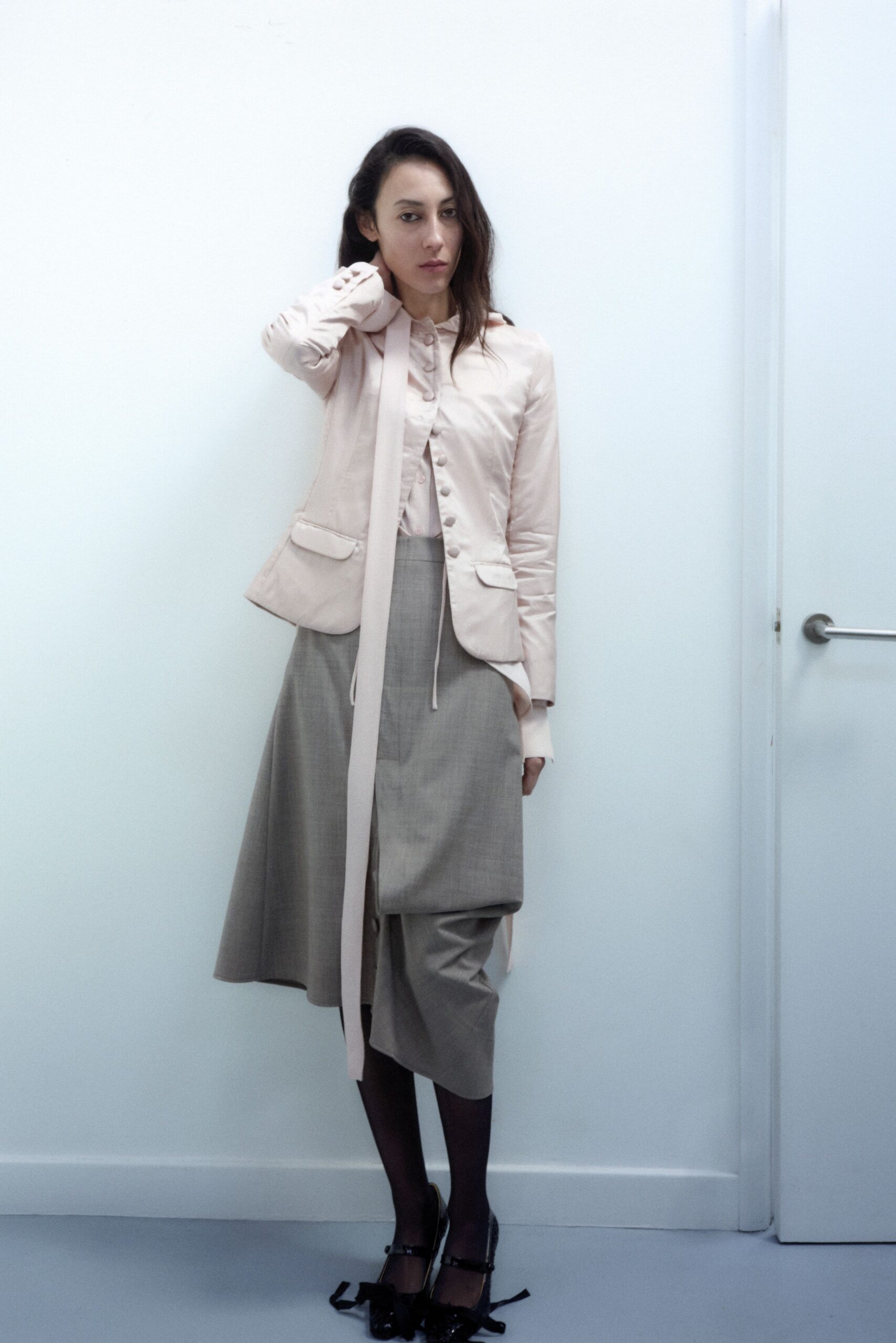 pink silk blazer with gray skirt