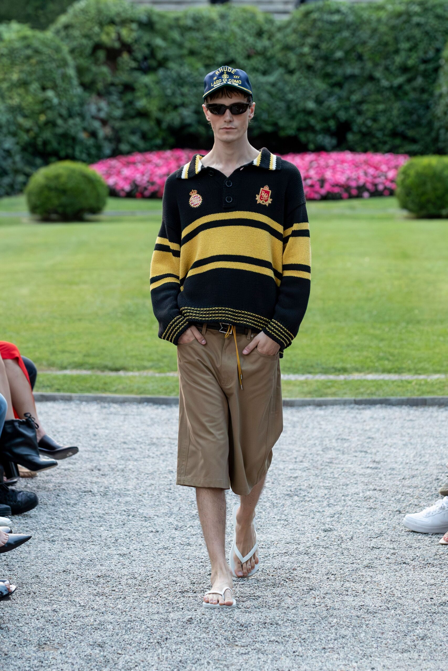 black and yellow striped top with beige shorts