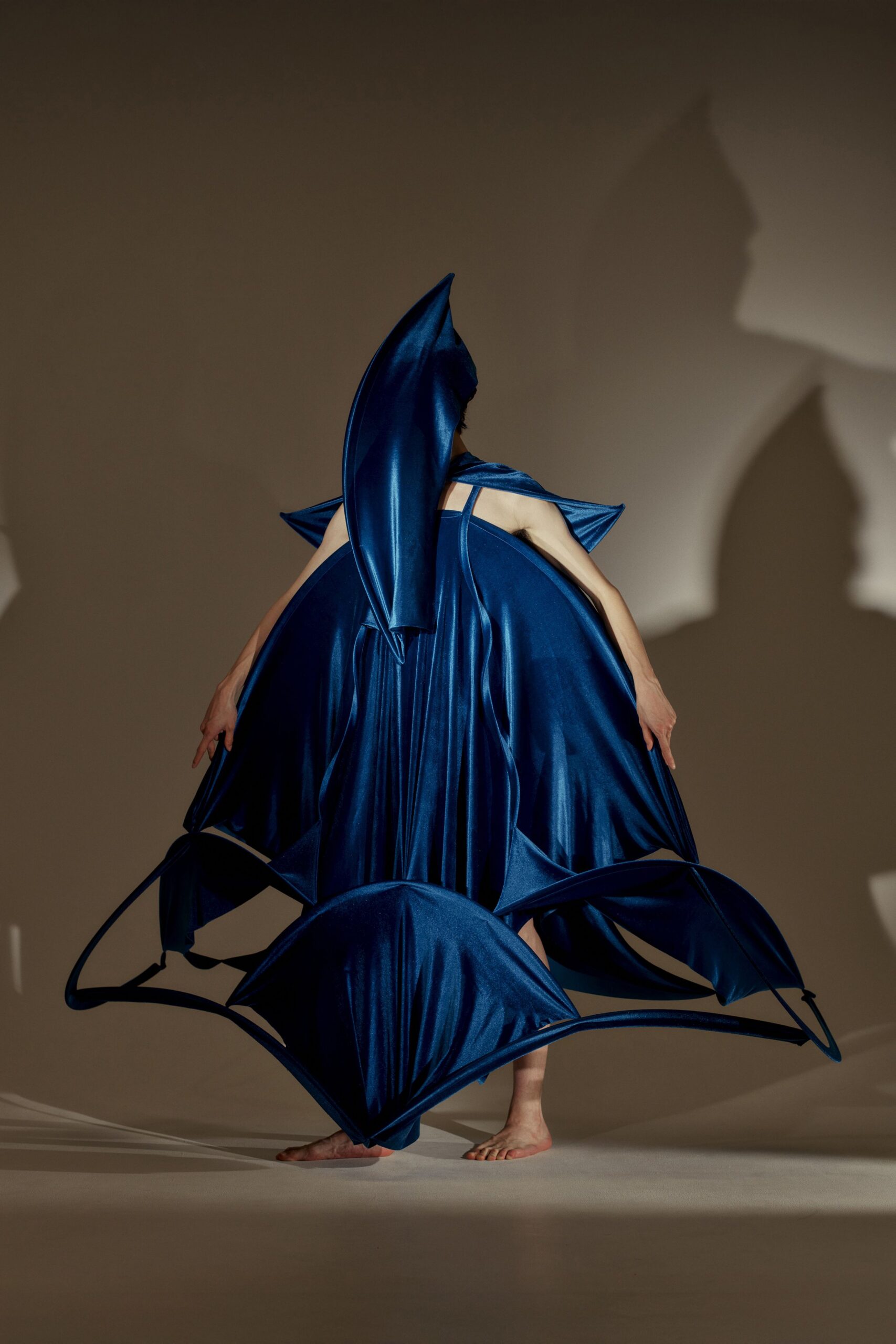 blue draped sleeveless dress