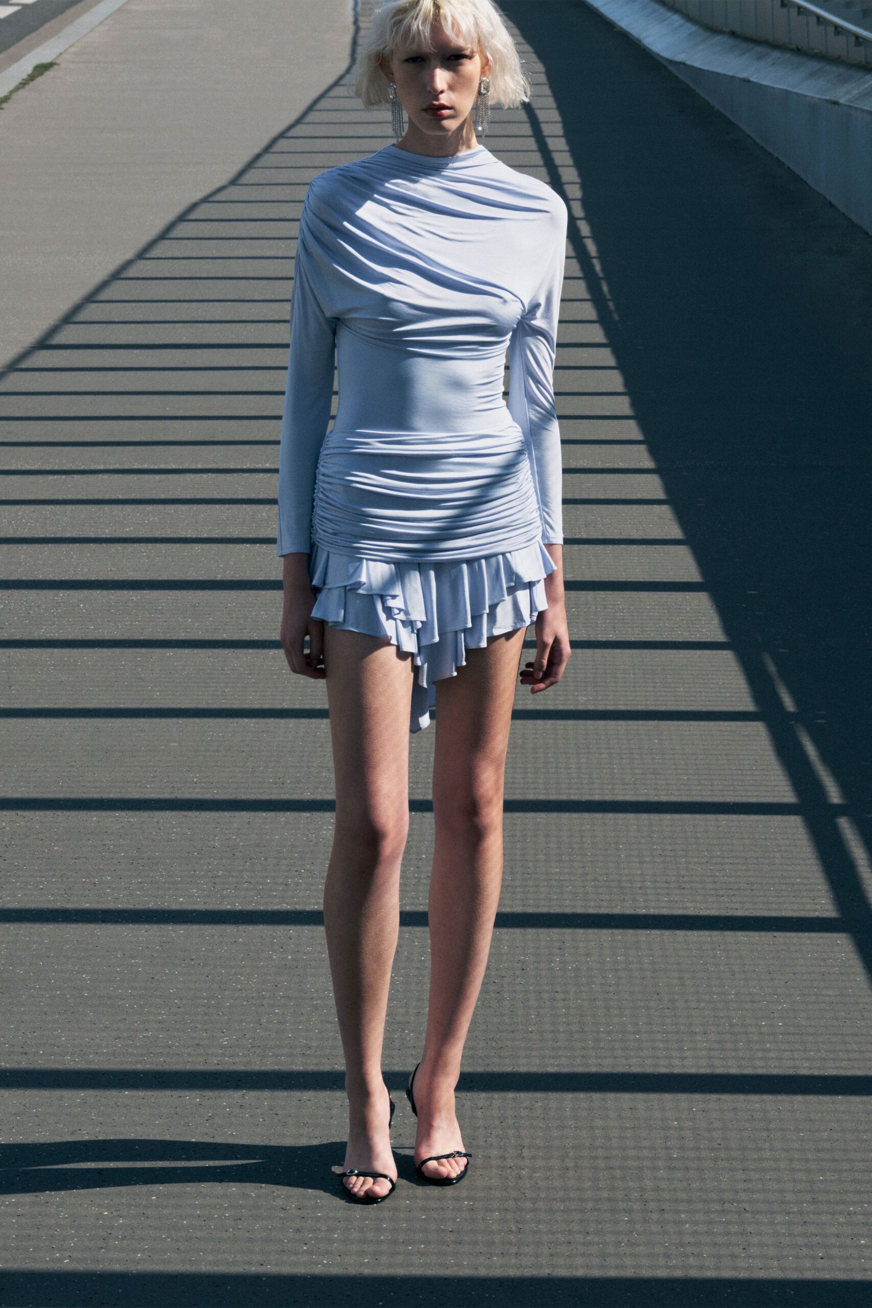 light blue fitted mini dress with long sleeves