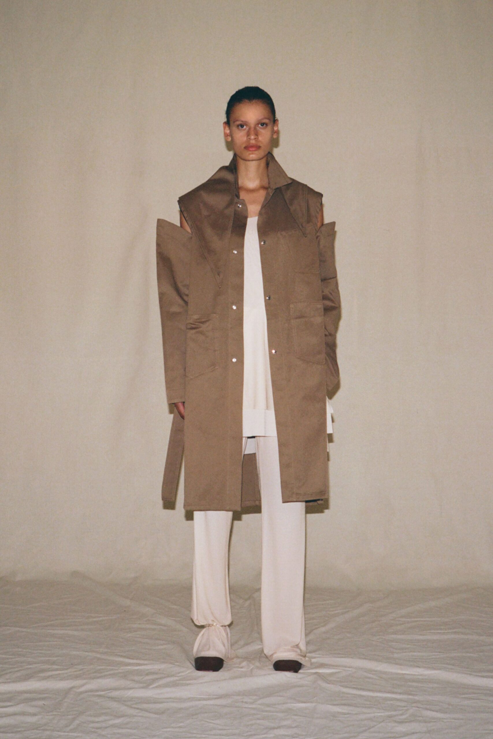 brown coat white top relaxed pants