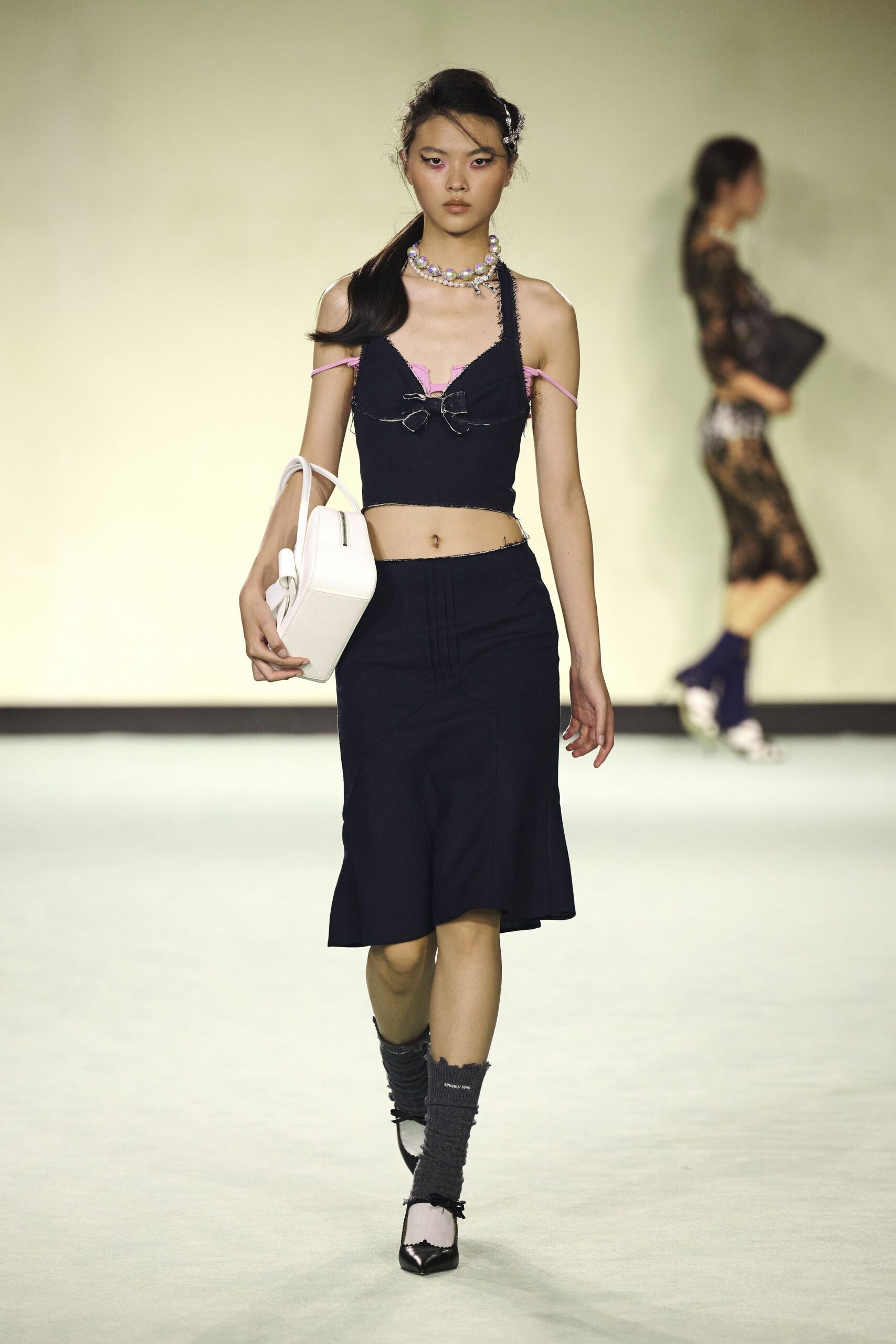 black fitted top and navy midi skirt