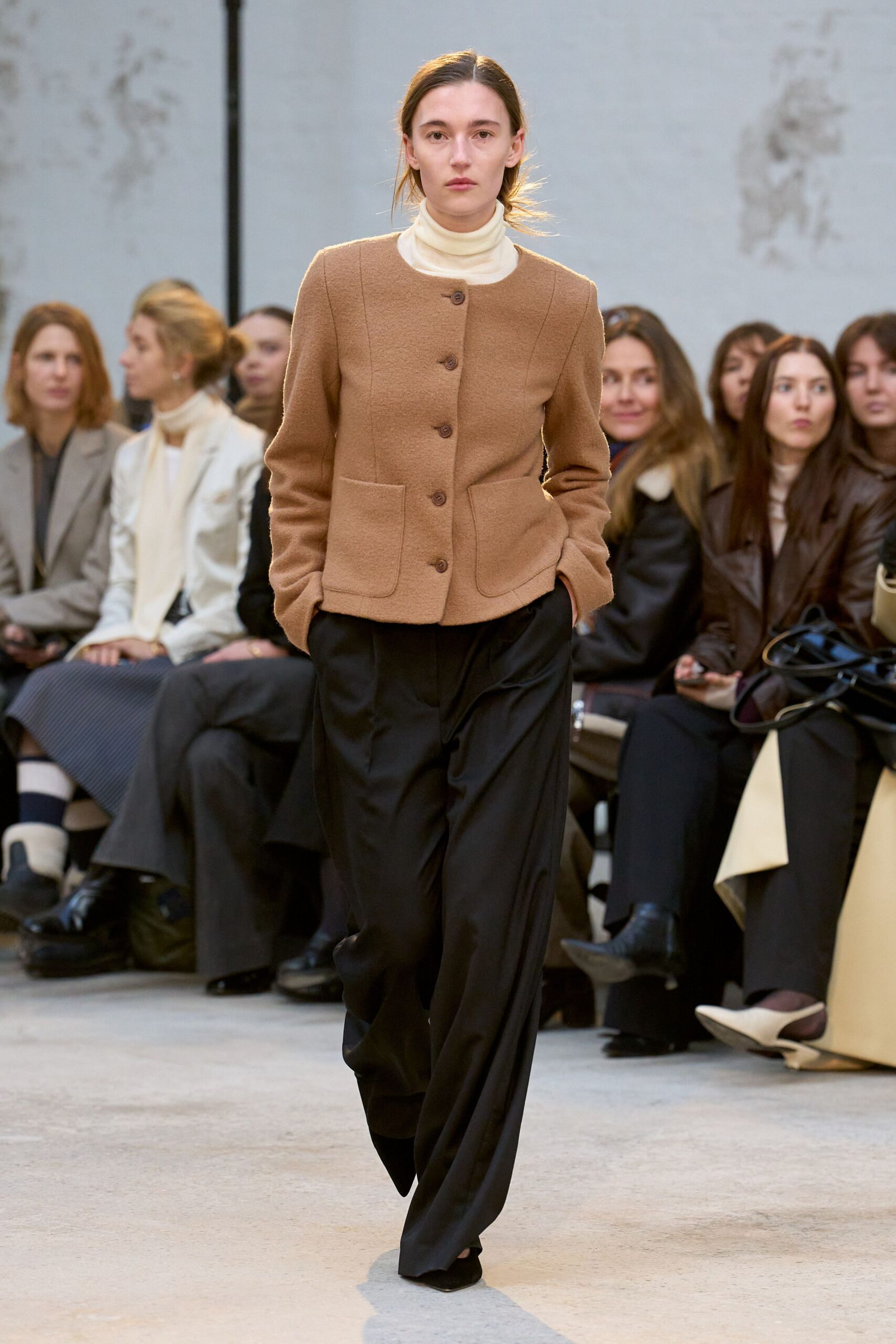 brown jacket ivory turtleneck black pants