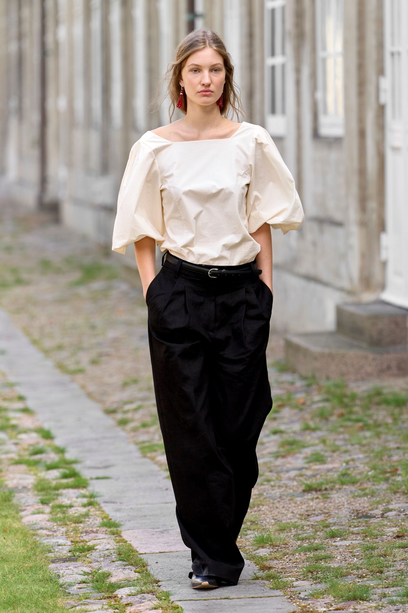 white off-shoulder top black pants