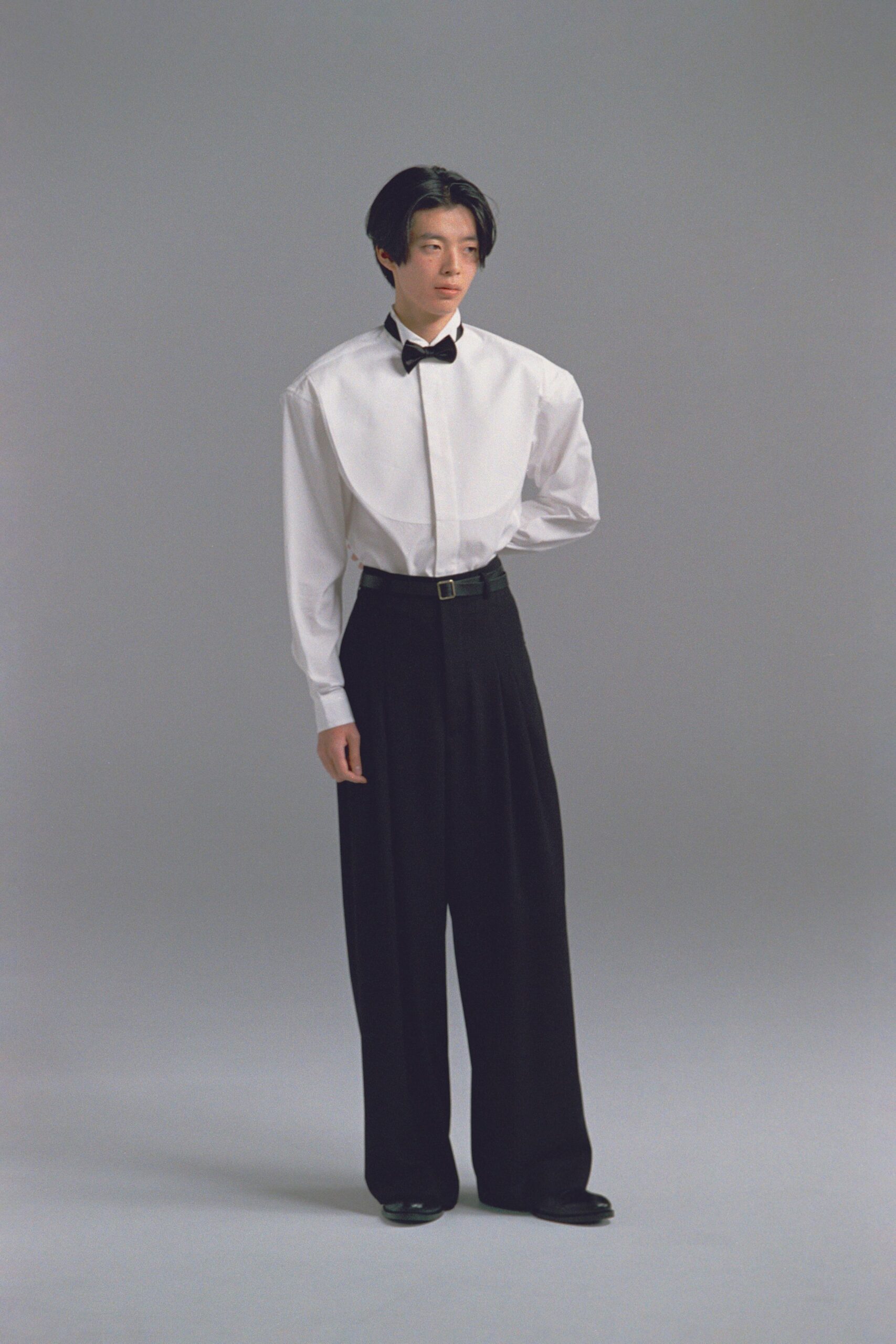 white relaxed shirt with black pants