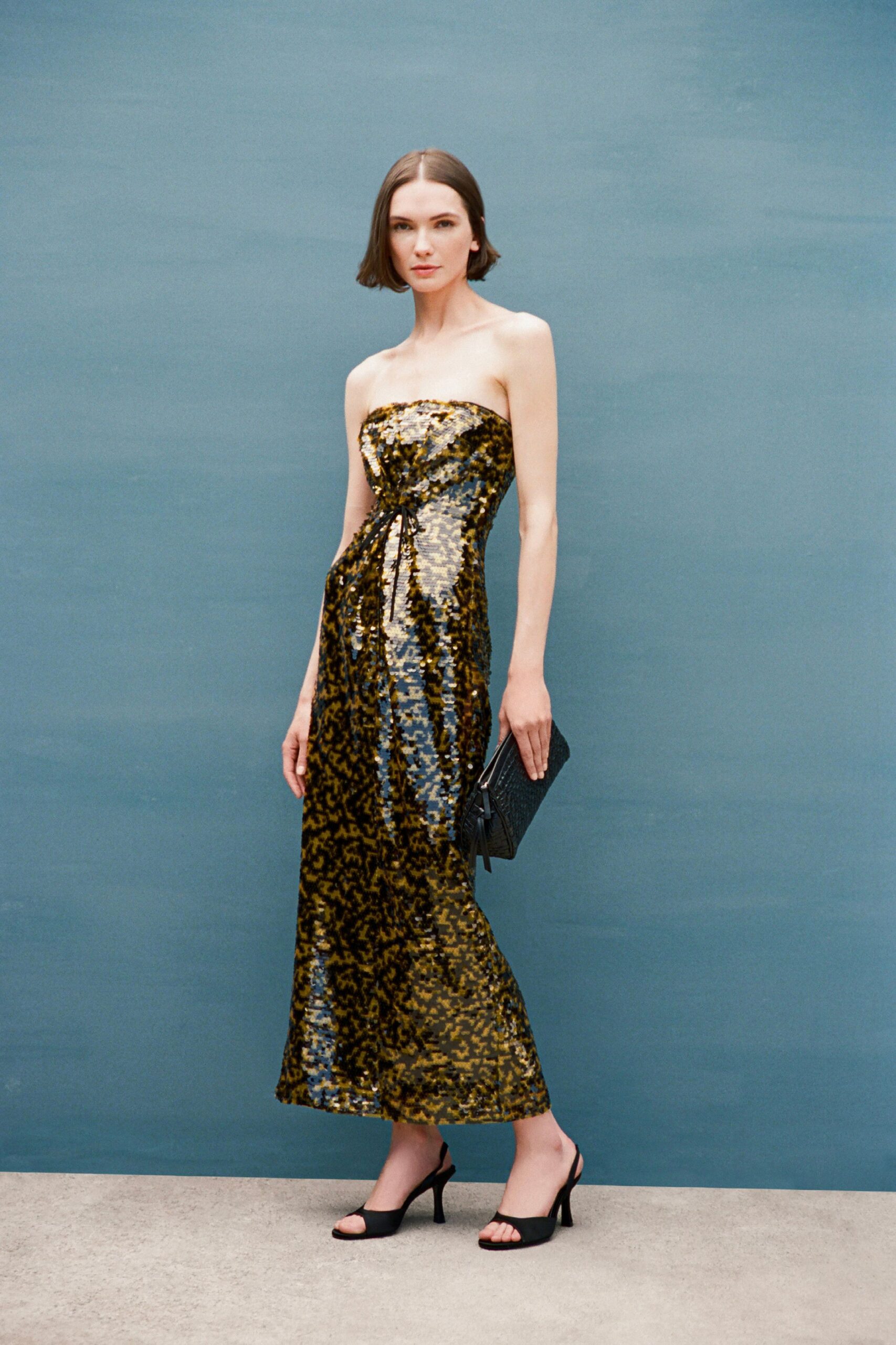 black sequin strapless fitted draped layered shiny gown