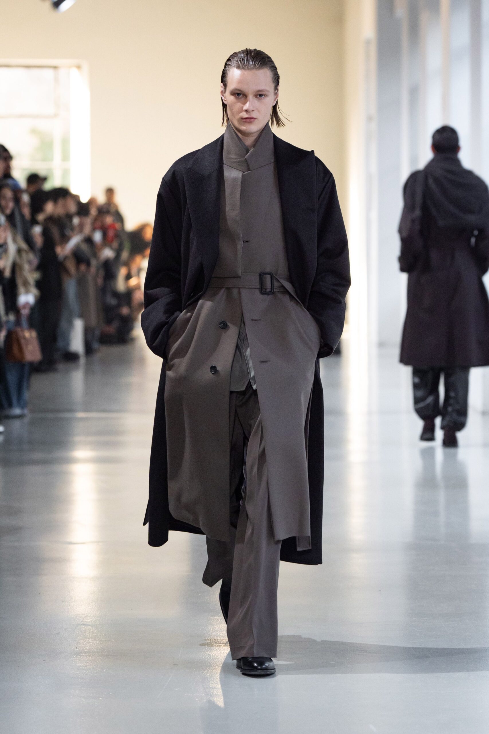 black coat gray pants outfit