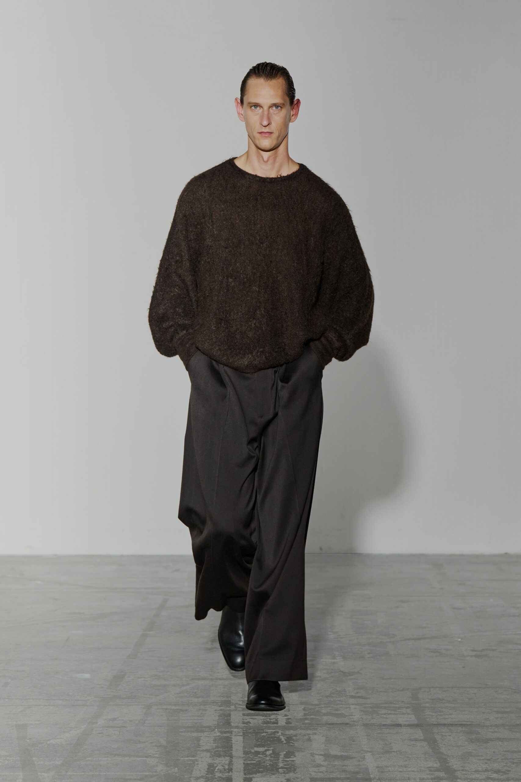brown wool relaxed sweater with black tailored pants