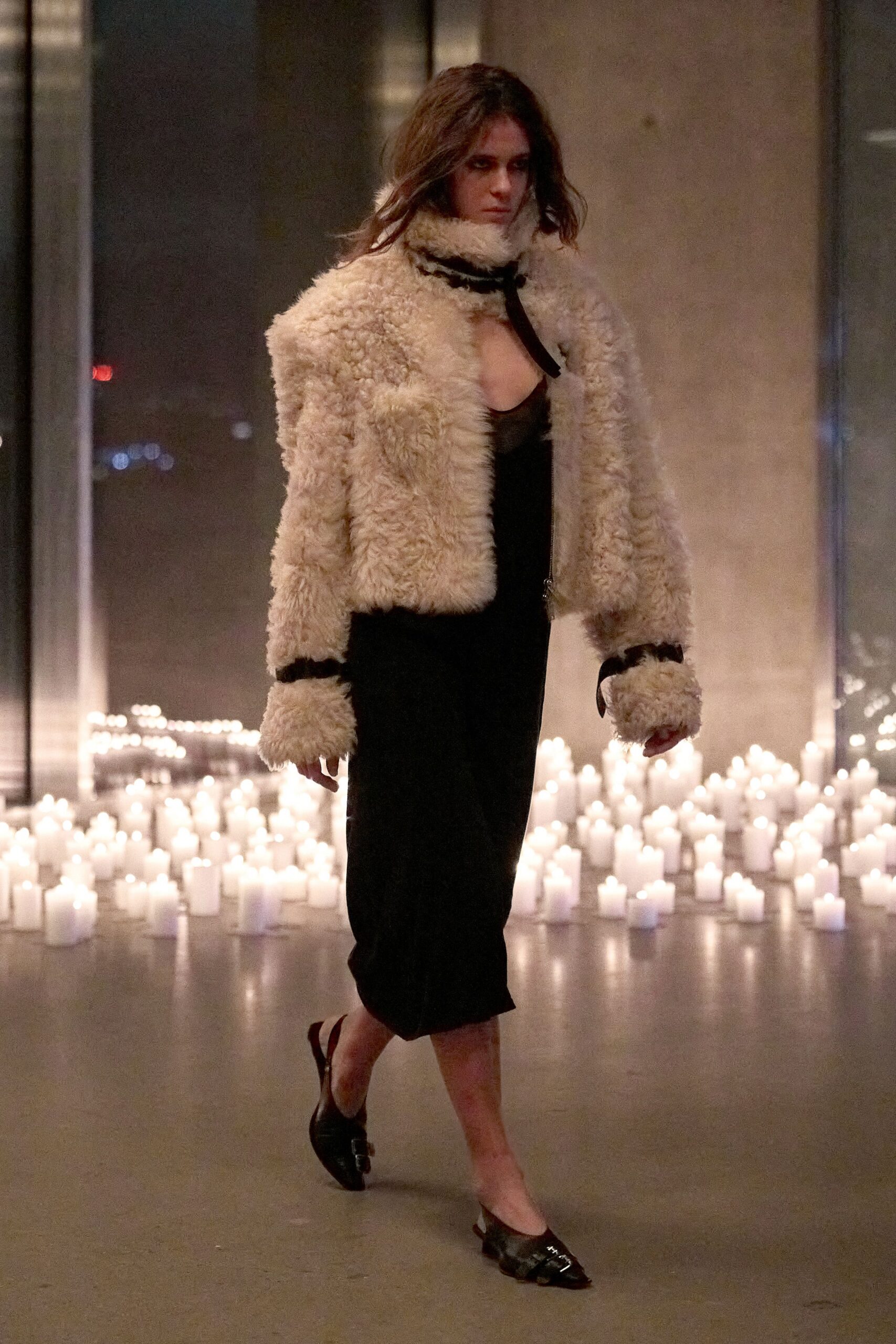 beige faux-fur coat black dress