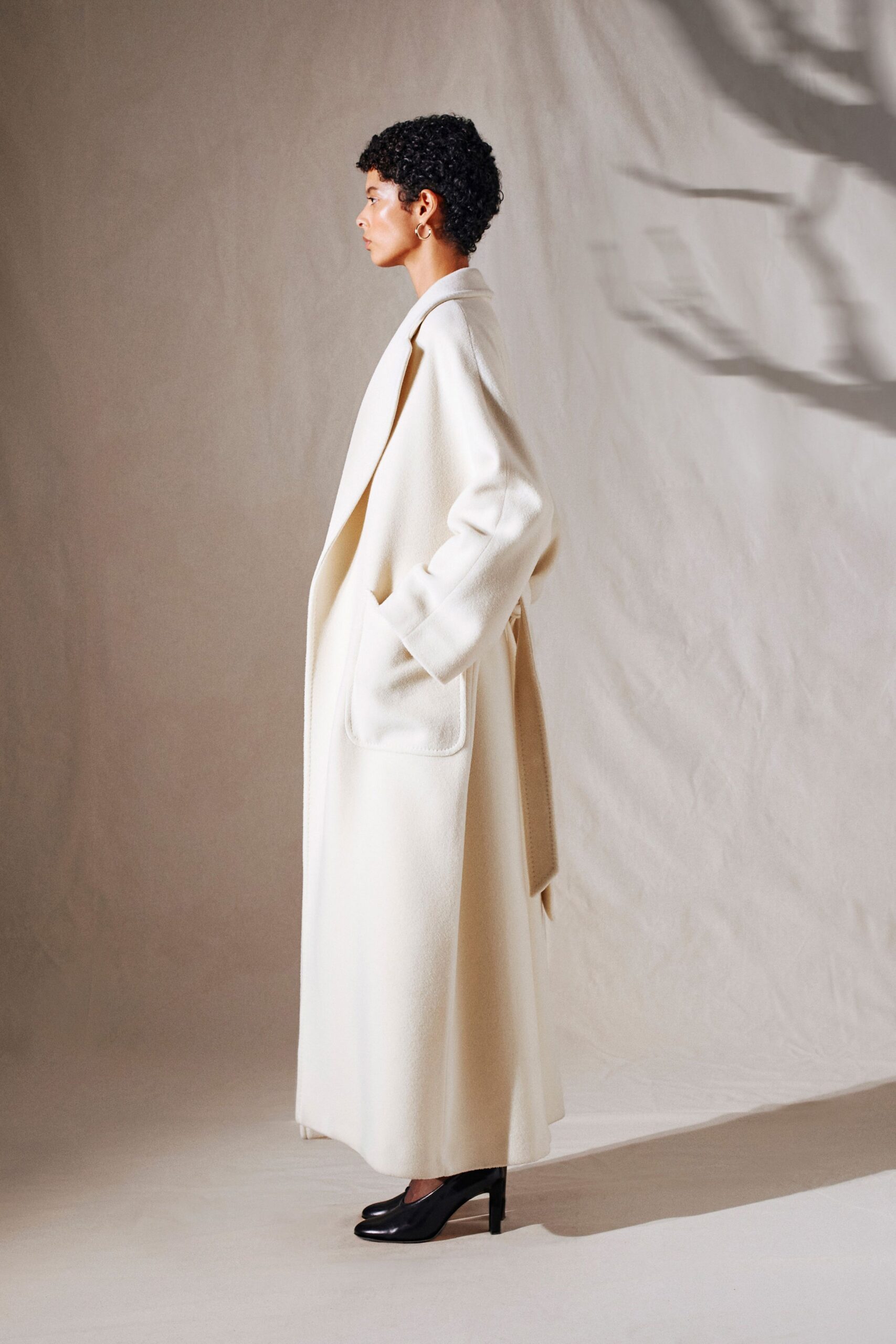 white wool long-sleeve collared relaxed belted maxi coat