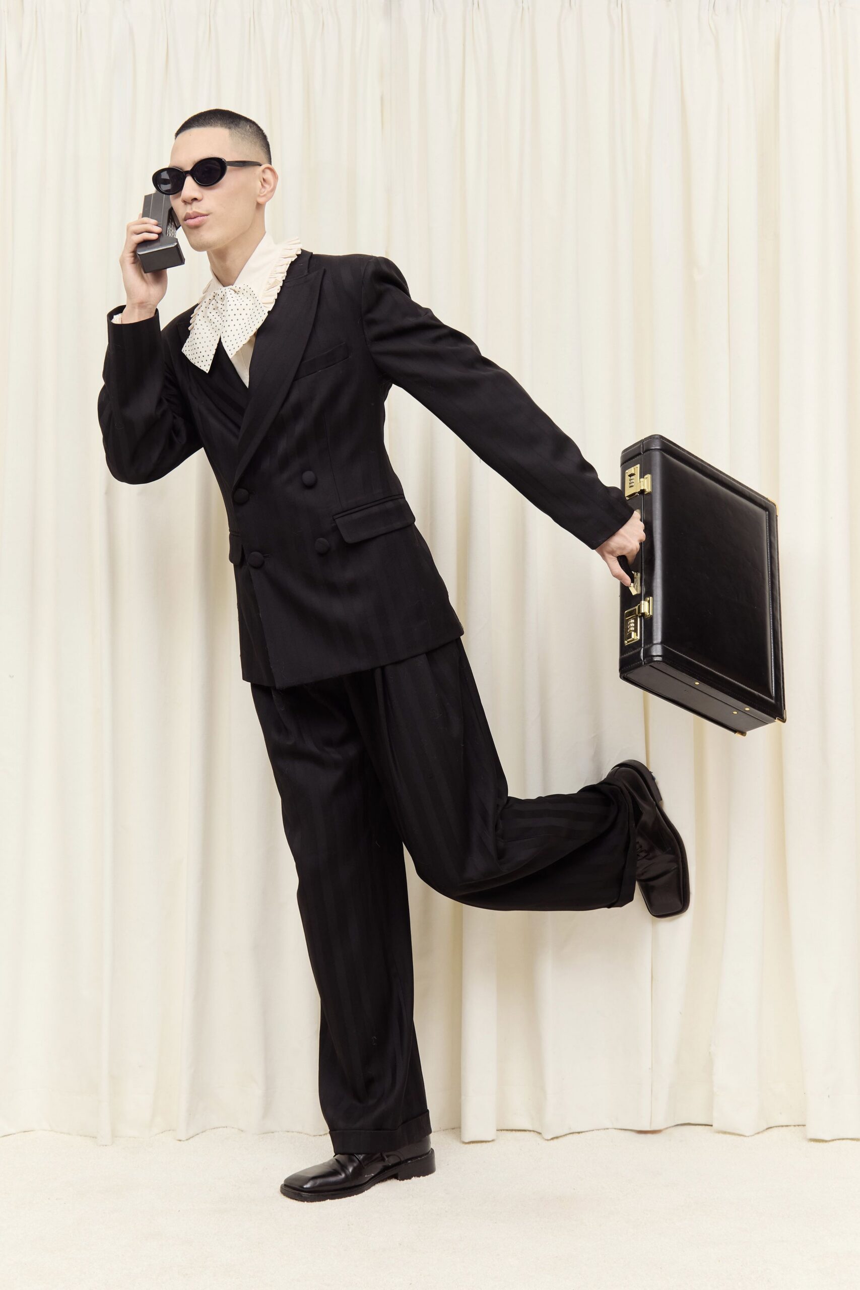 black tailored suit with white shirt