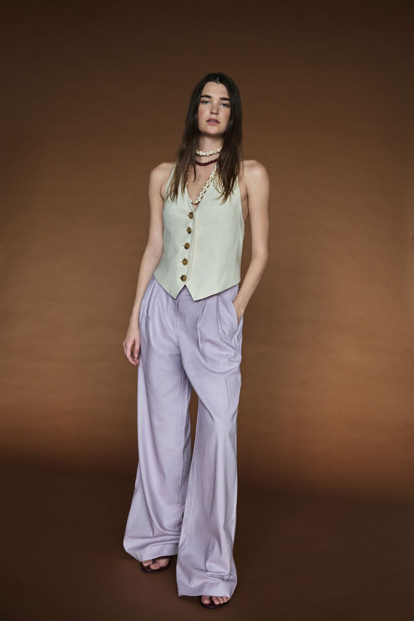 beige cotton sleeveless collared fitted buttoned vest