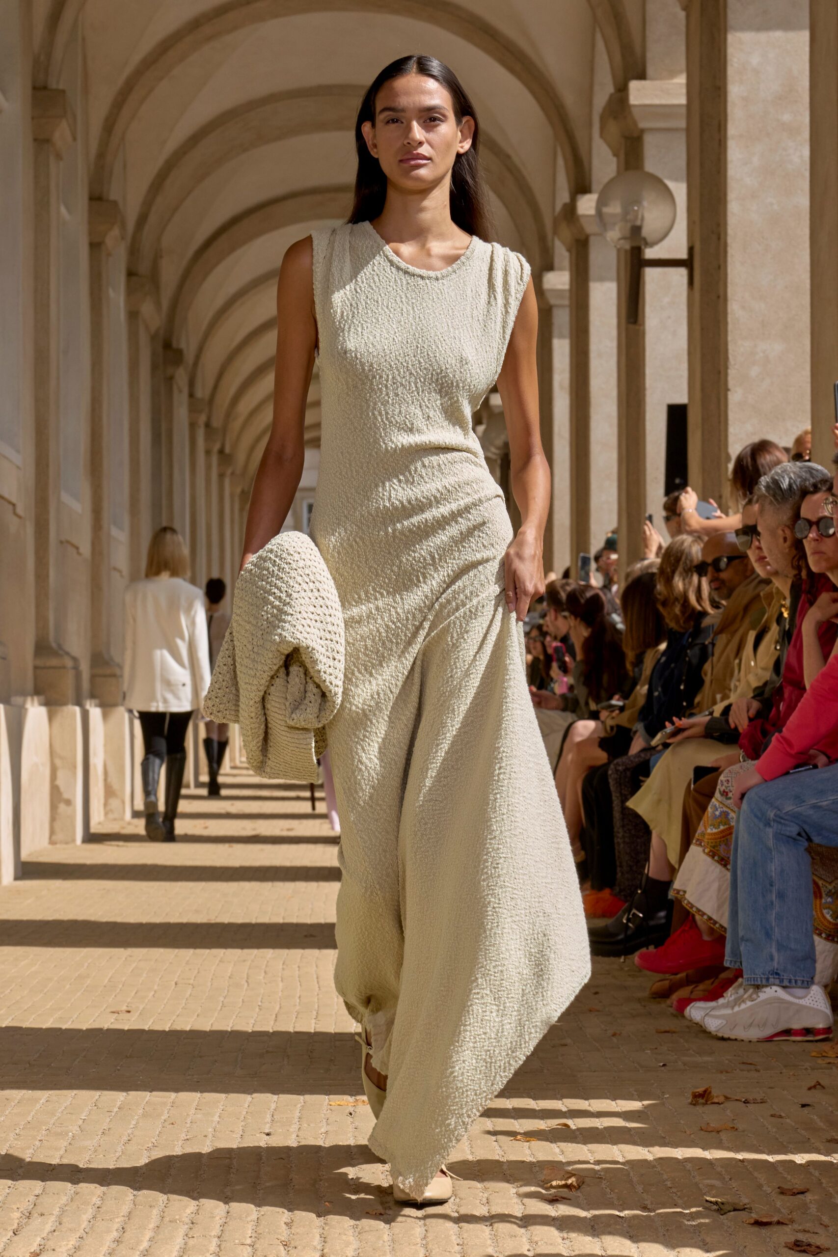 beige cotton sleeveless high-neck fitted pleated flowing dress