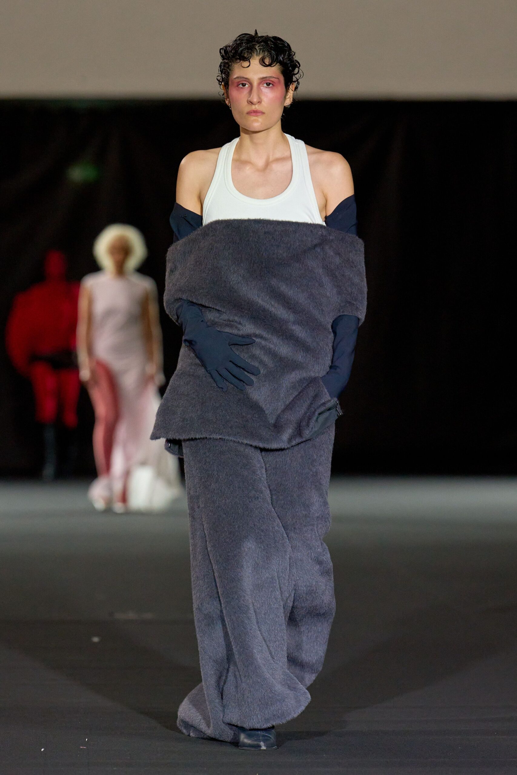 white sleeveless top gray coat pants