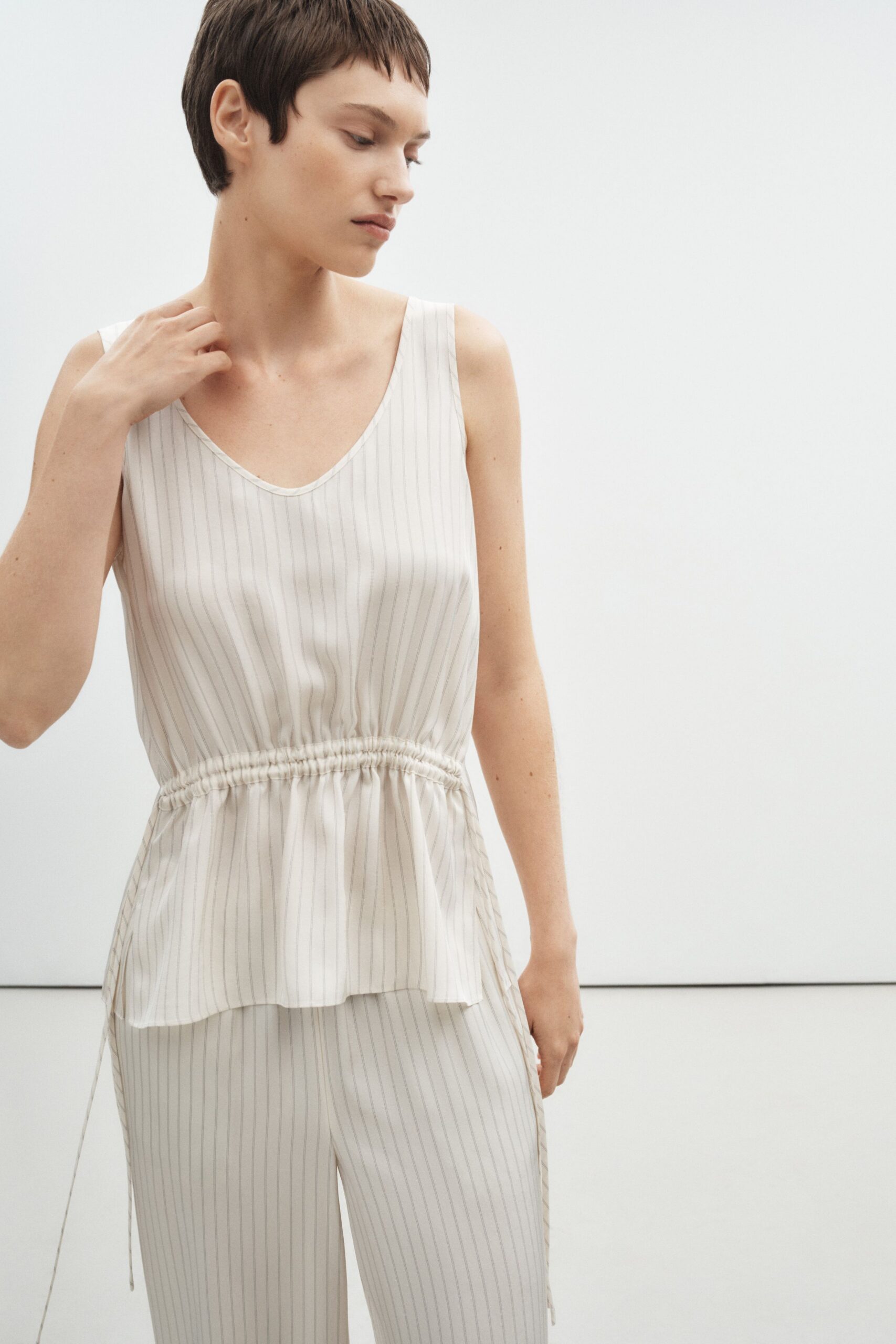 beige silk sleeveless v-neck relaxed striped draped top