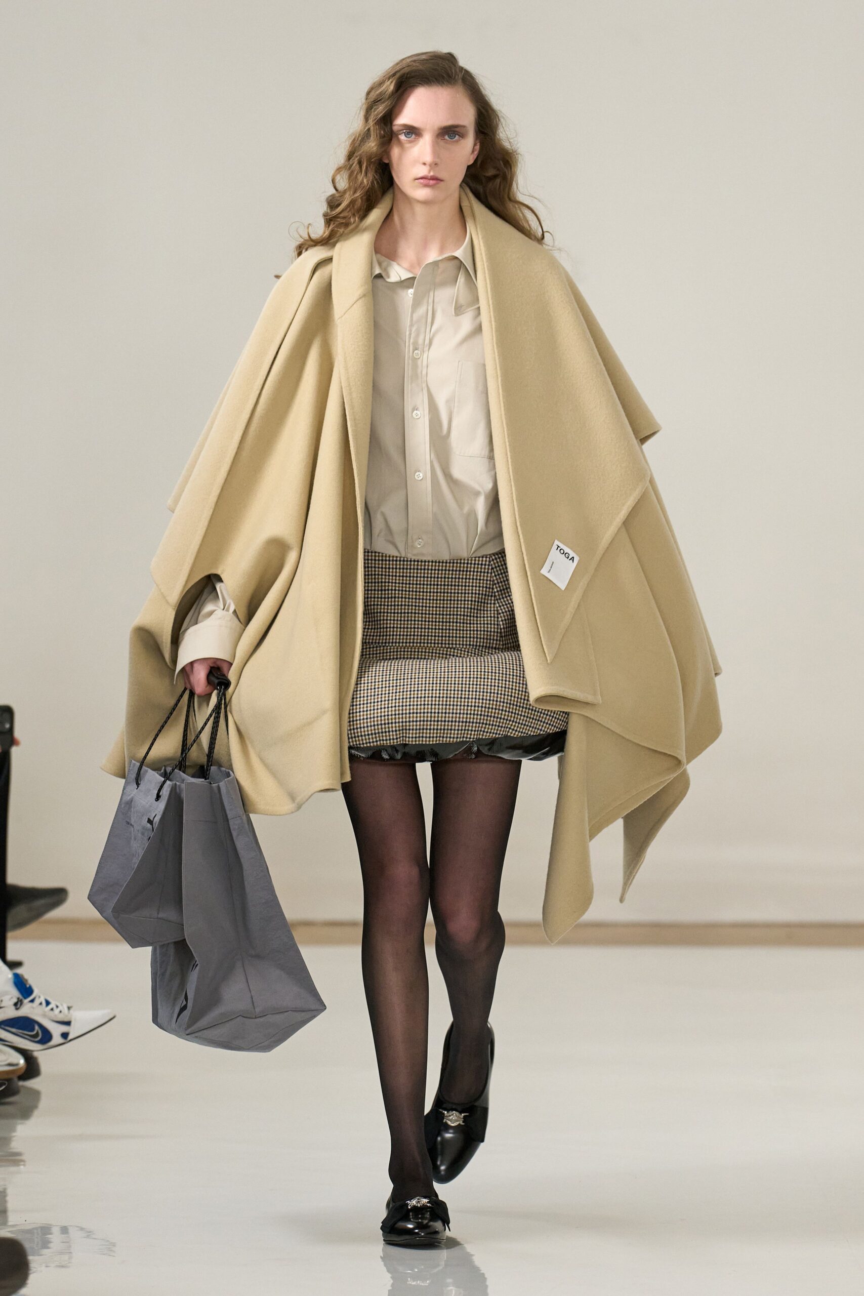 beige wool coat with black pencil skirt