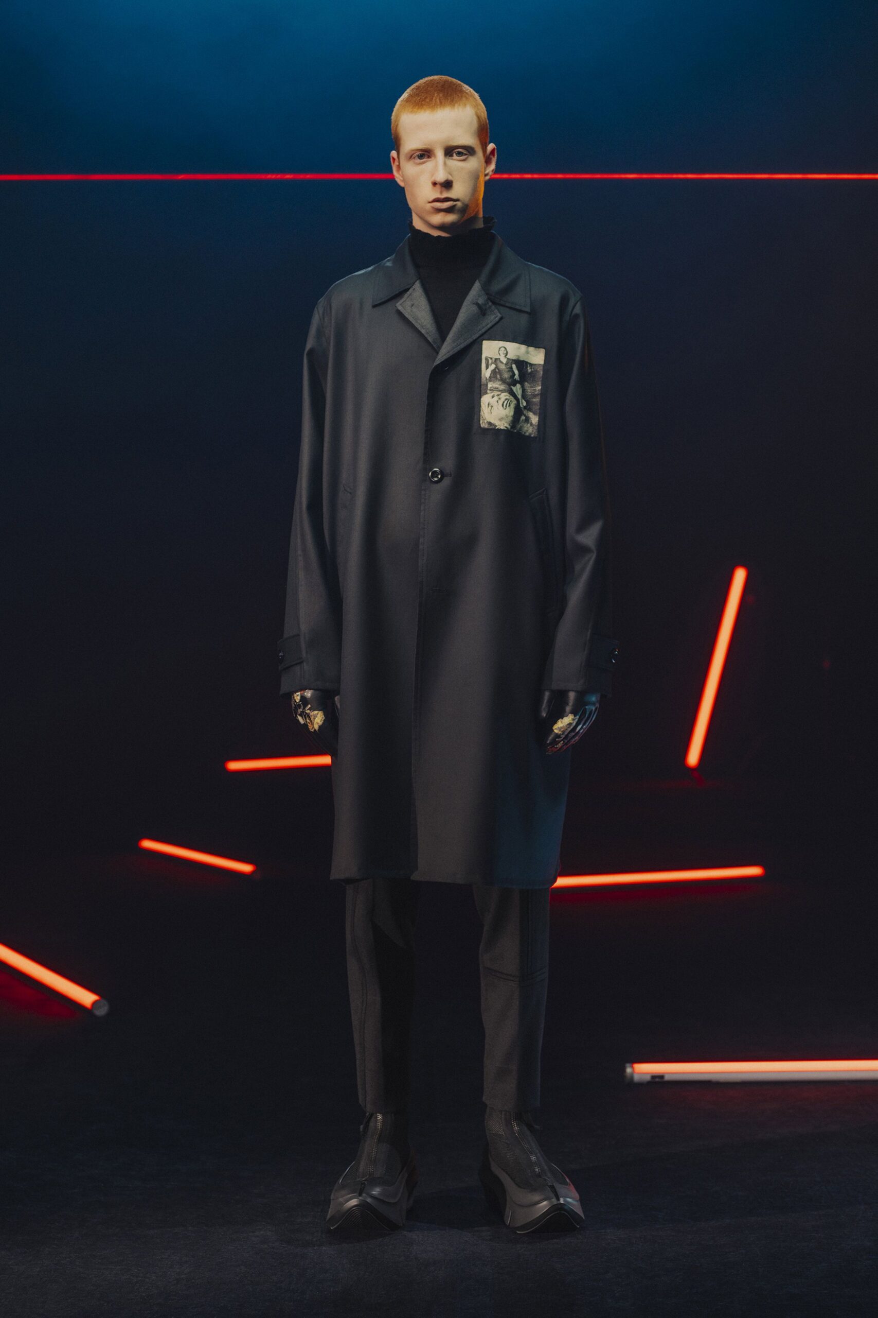 black relaxed coat and slim pants
