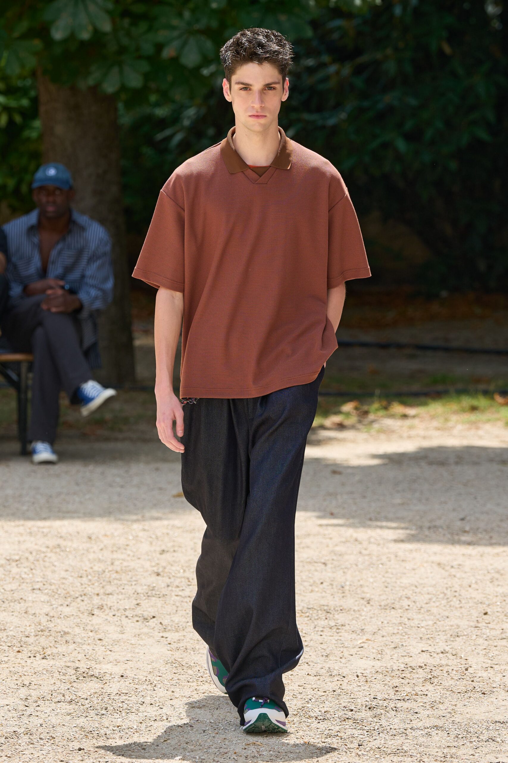 brown relaxed top with blue pants