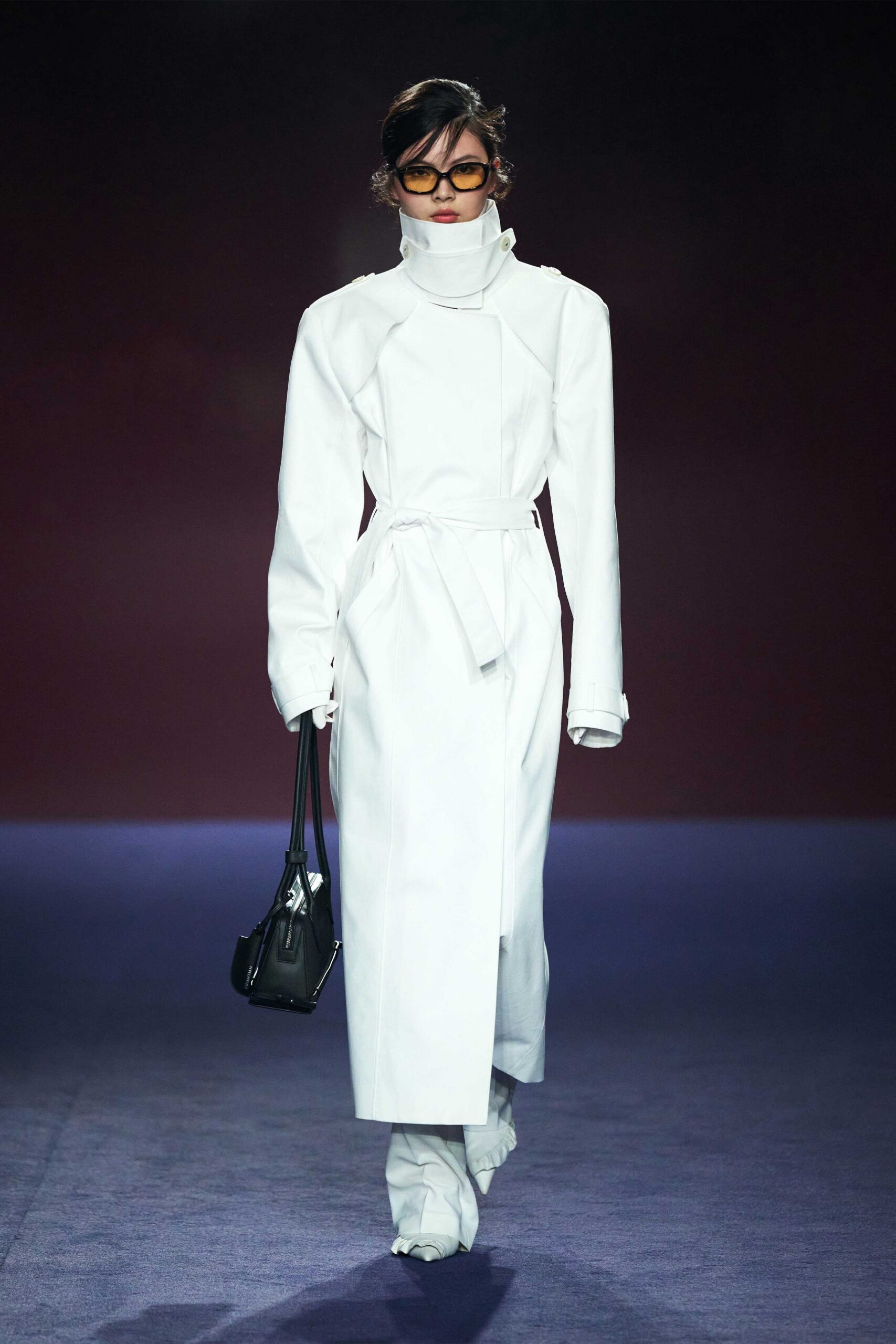 white fitted coat with black bag