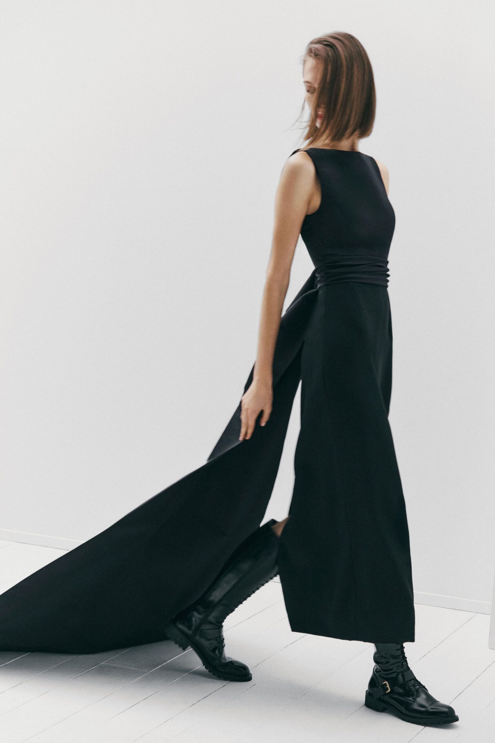 black silk sleeveless gown with boots