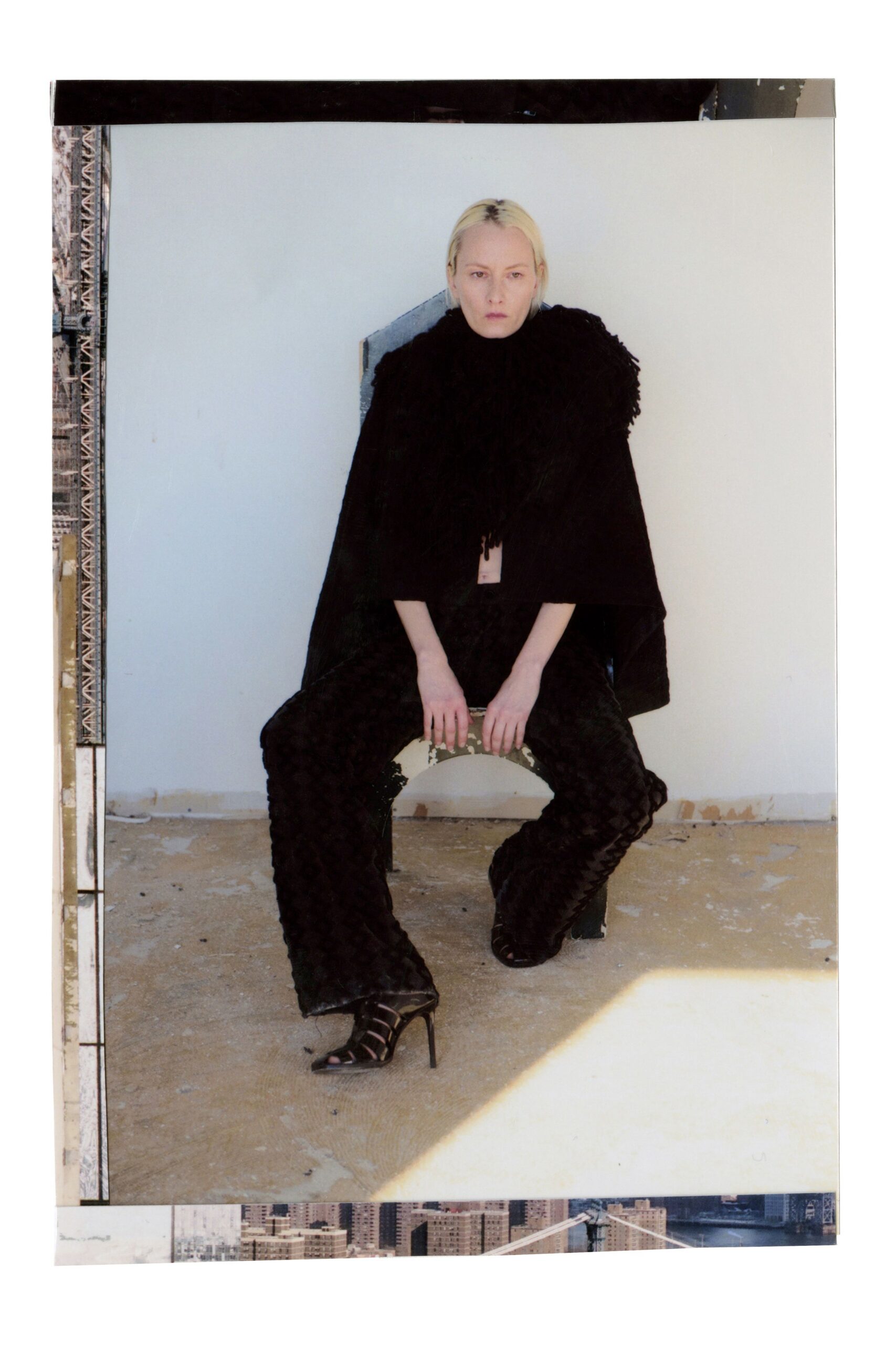 black fur cape with fitted pants