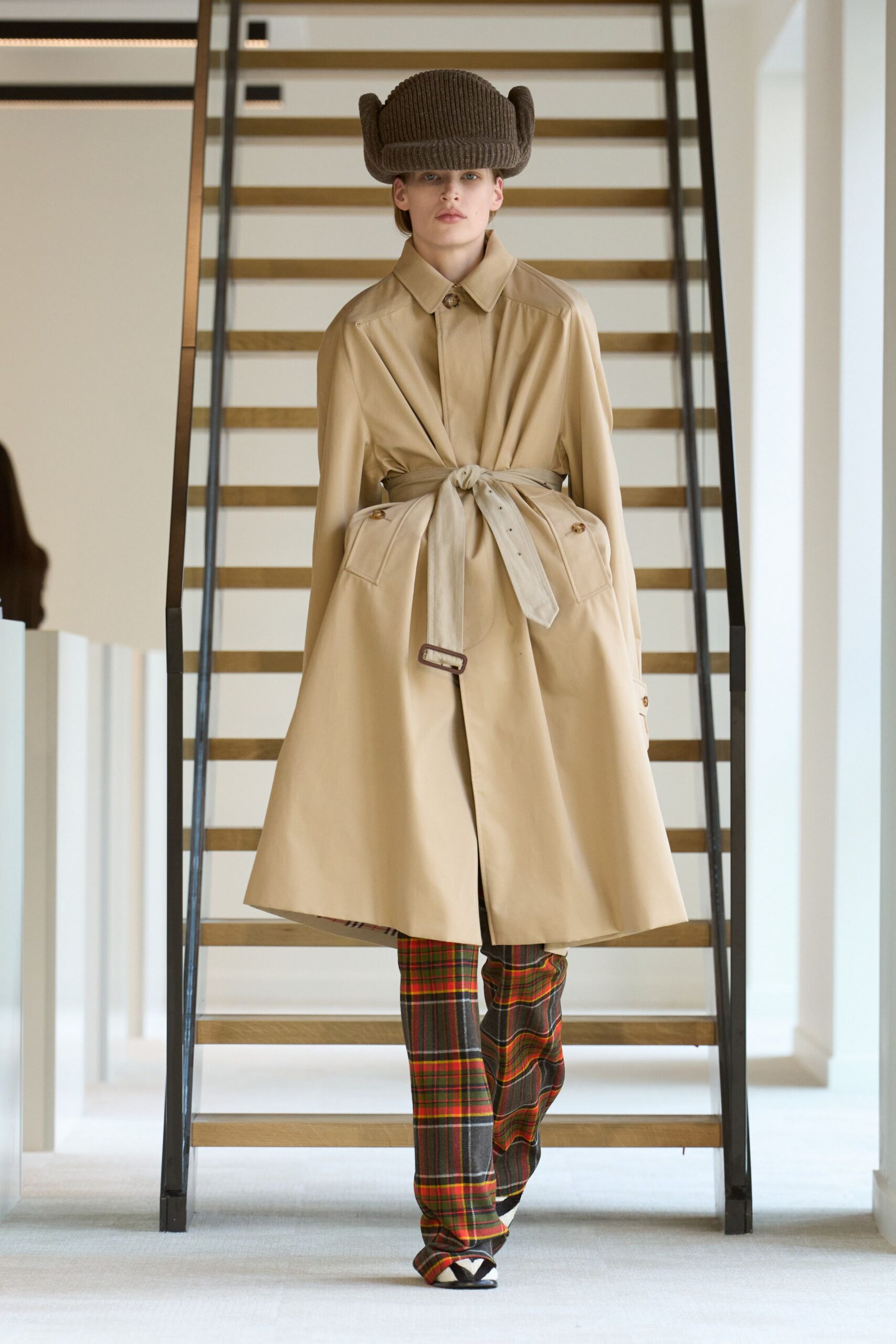 beige trench coat with checked pants