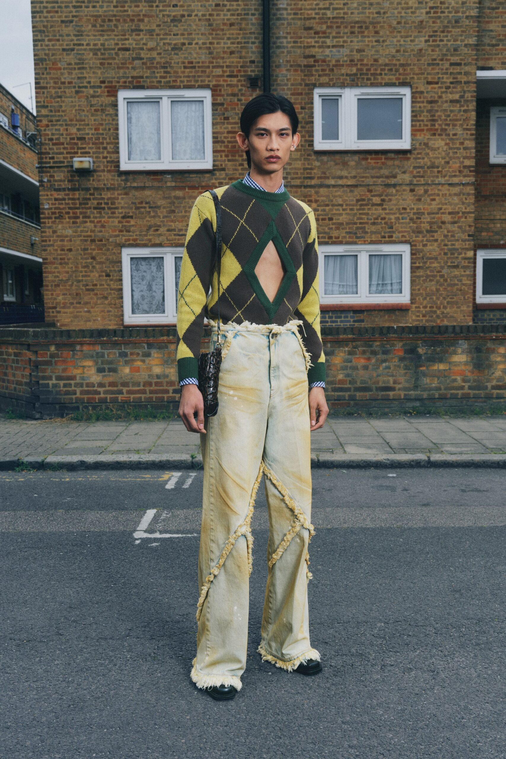 green yellow argyle sweater with distressed jeans