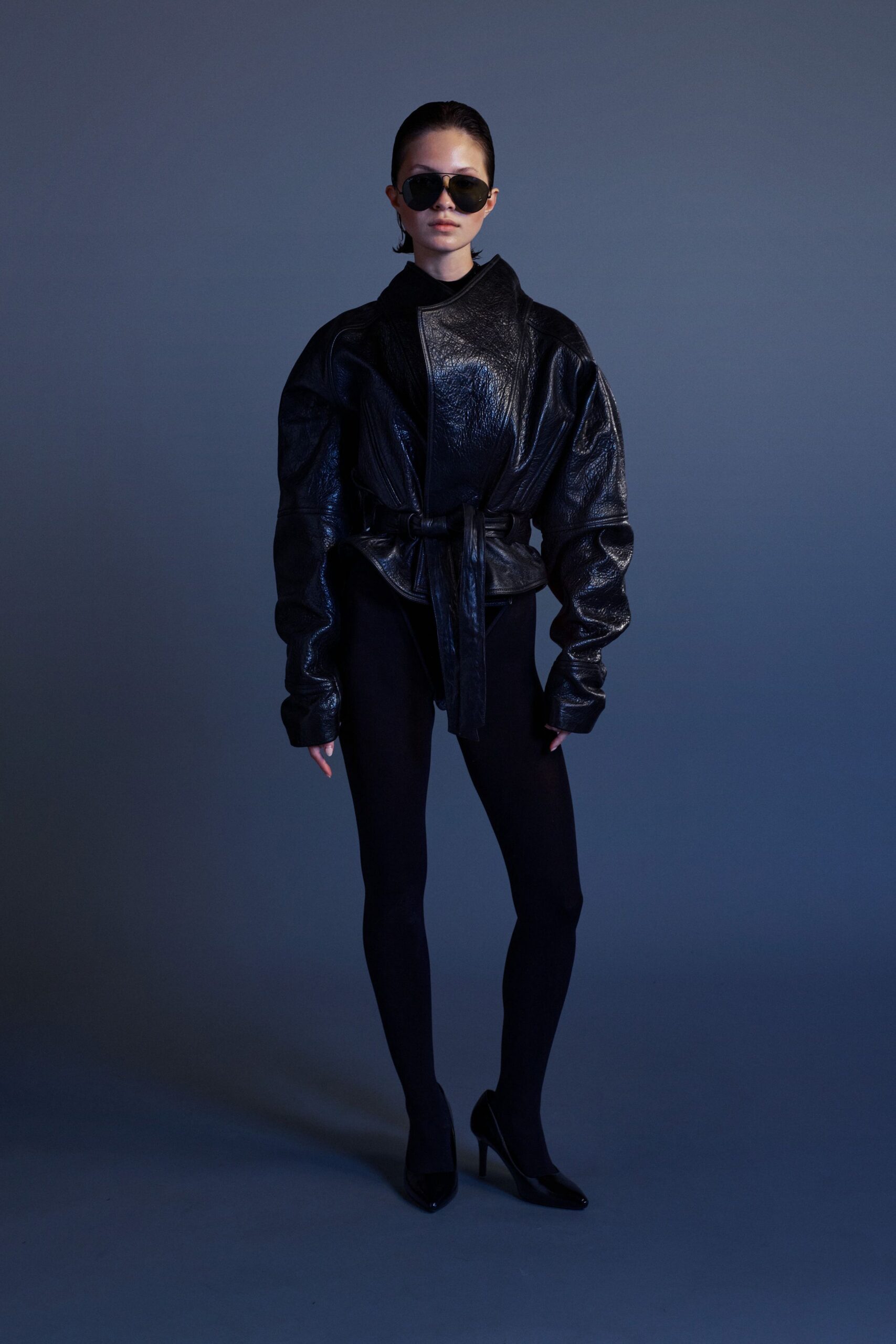 black leather long-sleeve collared oversized belted shiny jacket