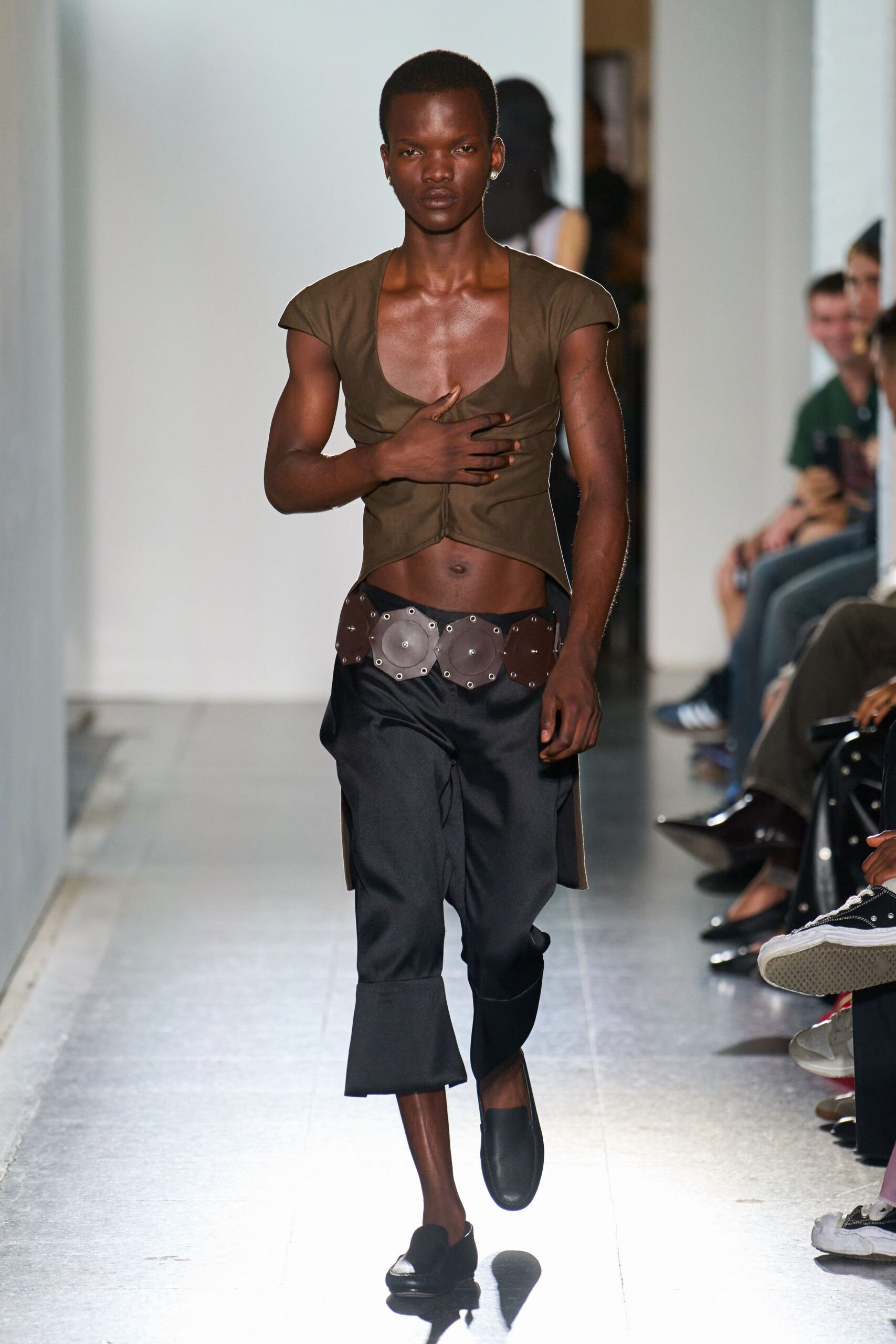 brown fitted top with black pants