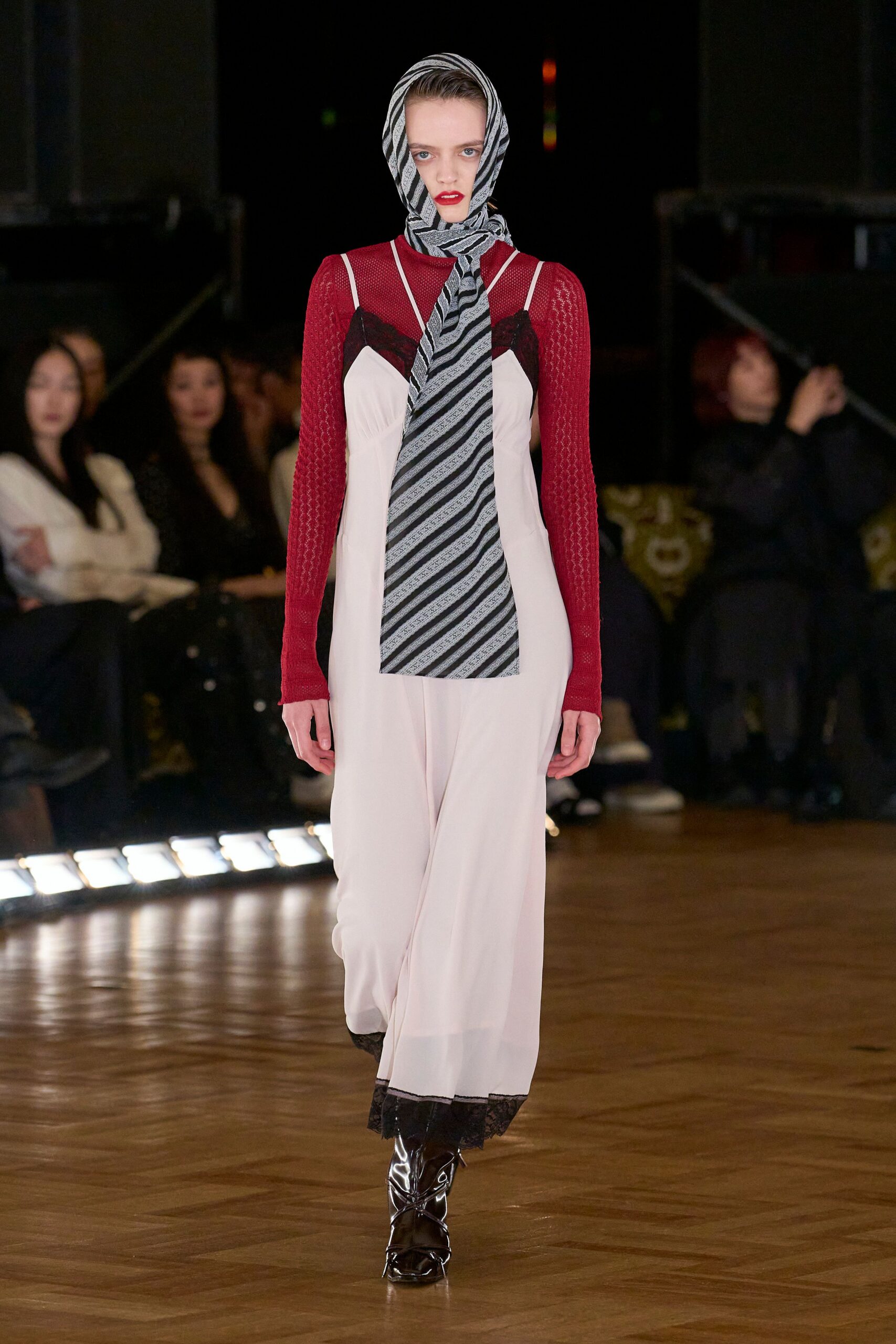 pink silk midi dress with red sweater