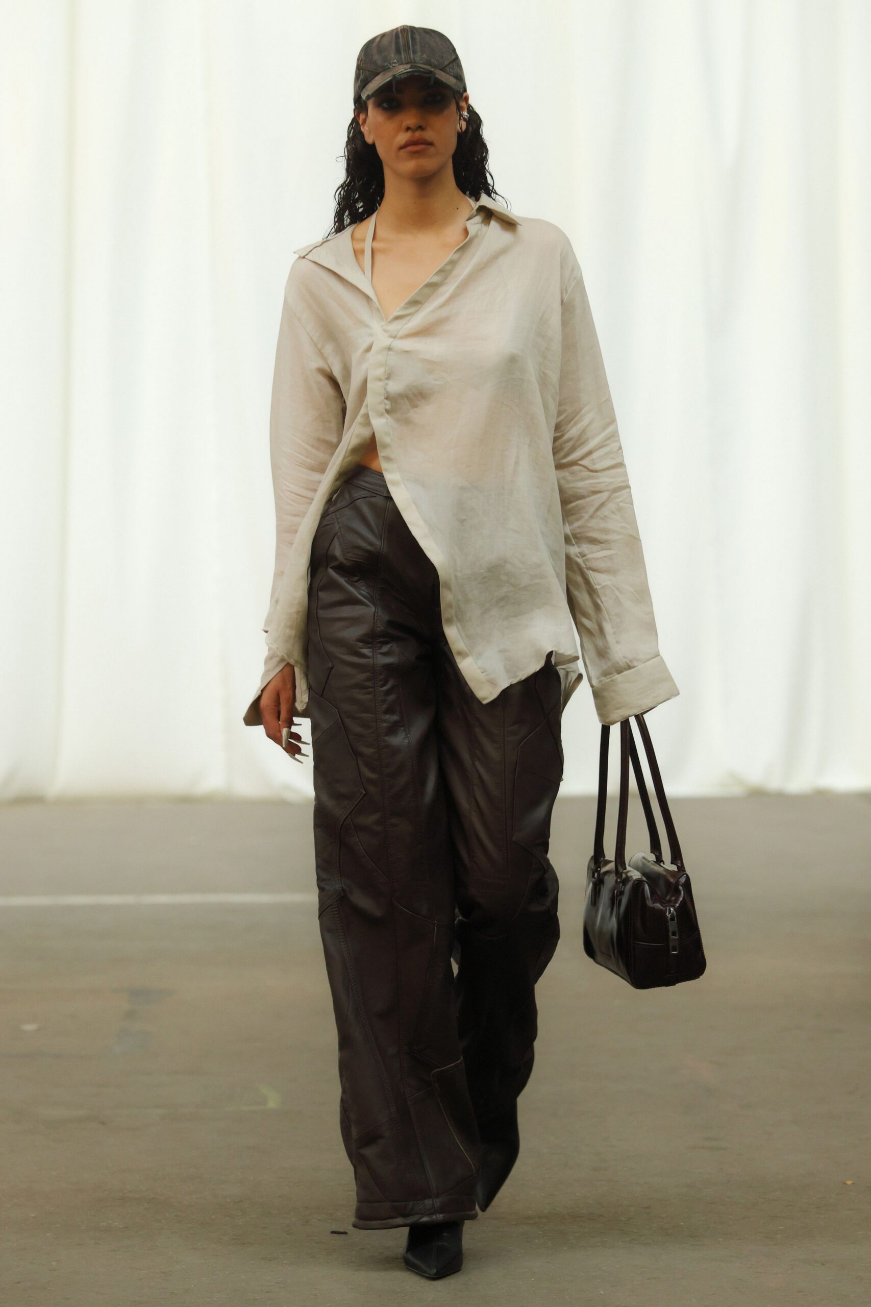 white relaxed shirt with brown leather pants