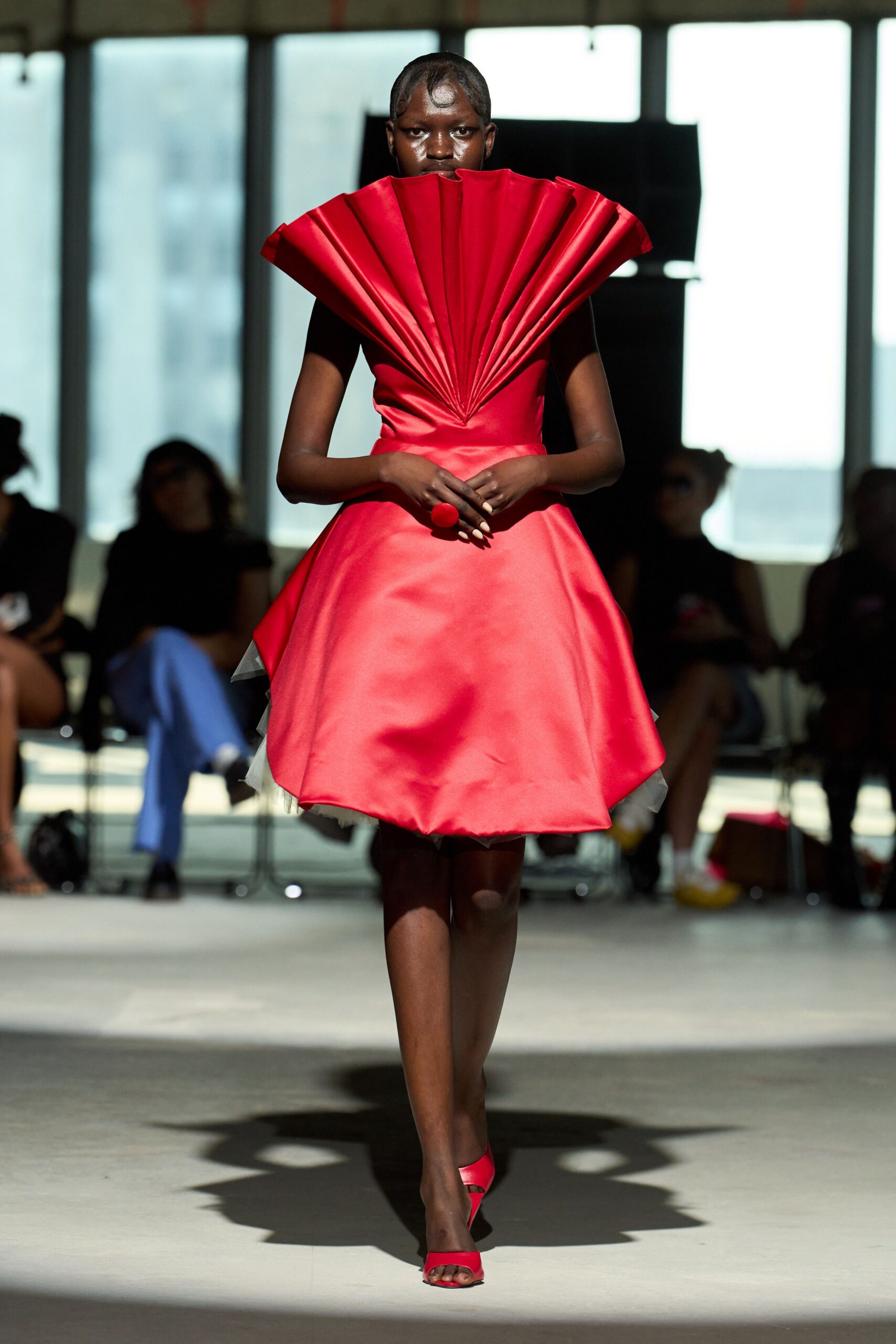 red silk sleeveless v-neck fitted pleated flared dress