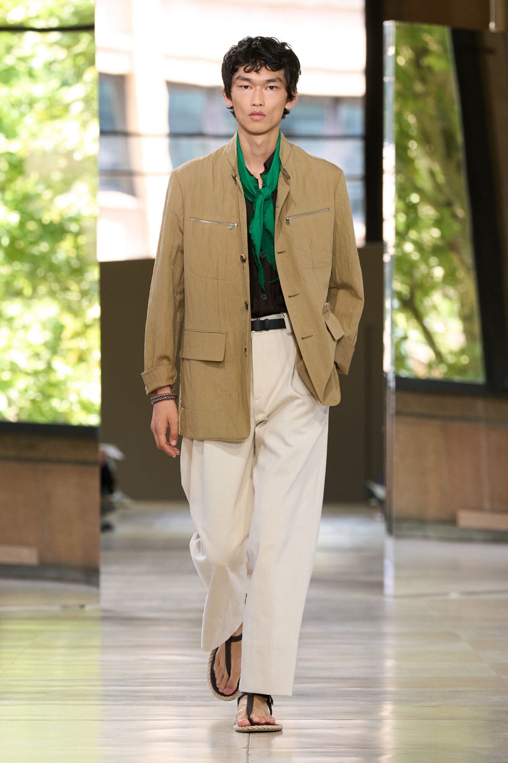 beige jacket green shirt white pants
