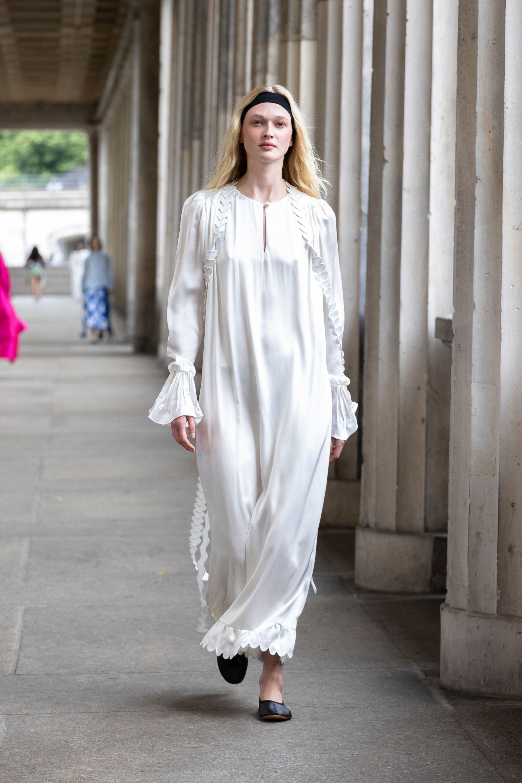 white silk long-sleeve collared relaxed ruffled flowing gown