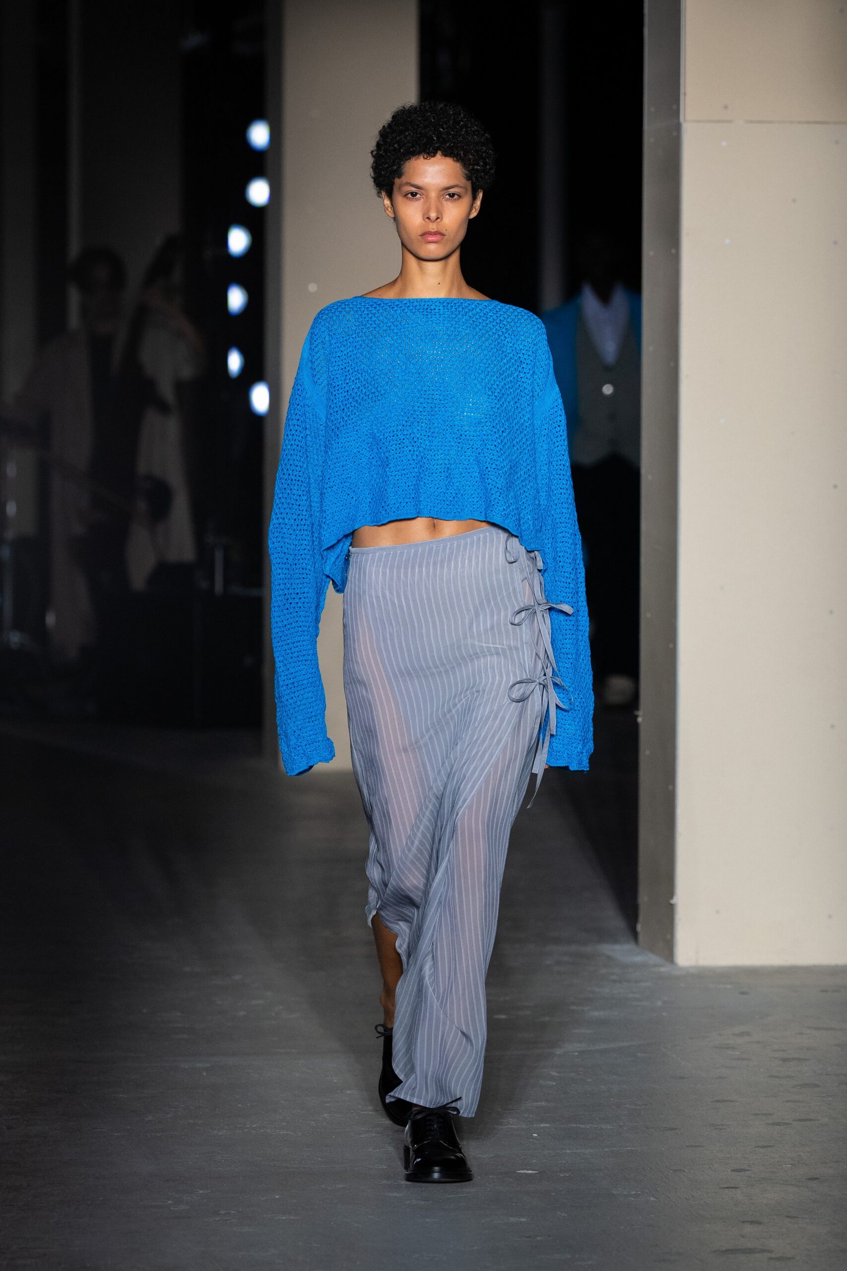 blue cropped top gray pleated skirt