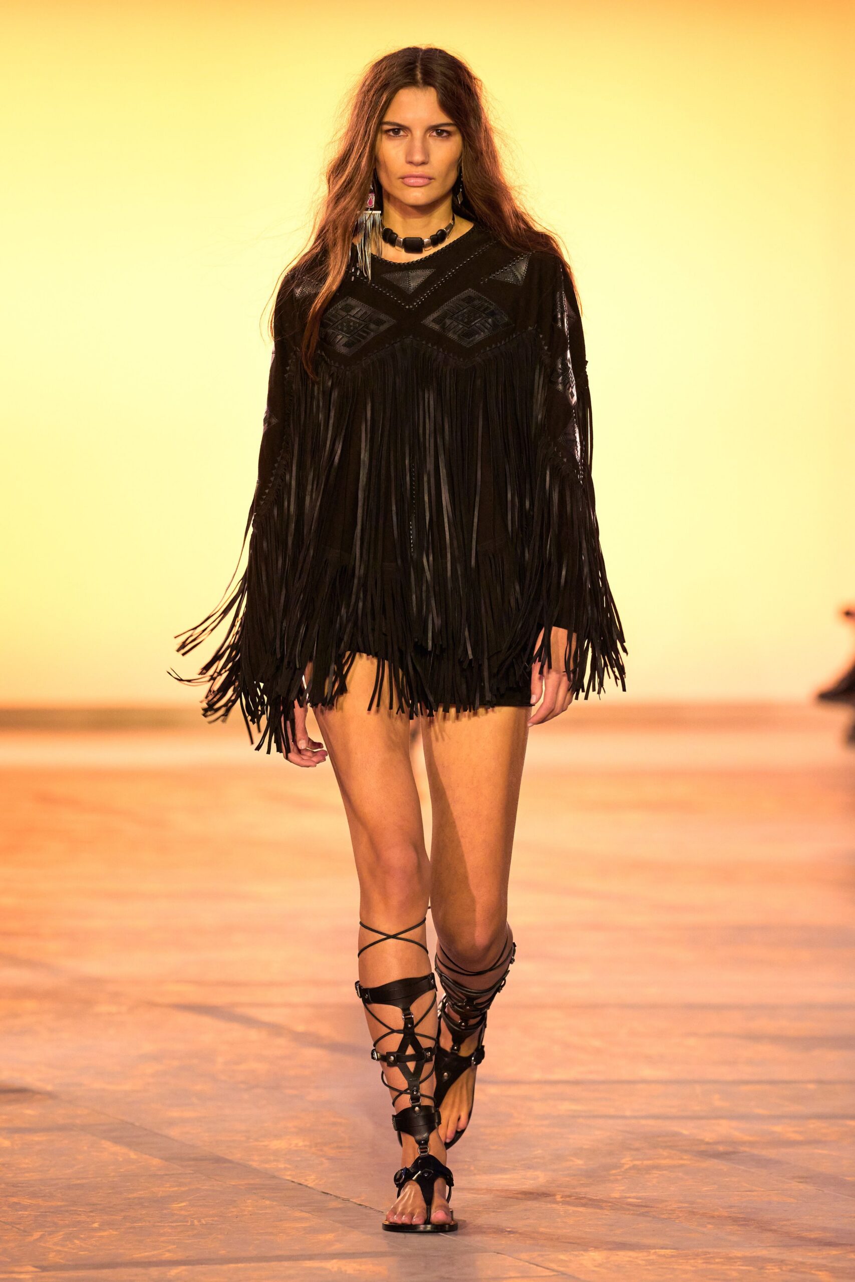 black leather fringed top and shorts