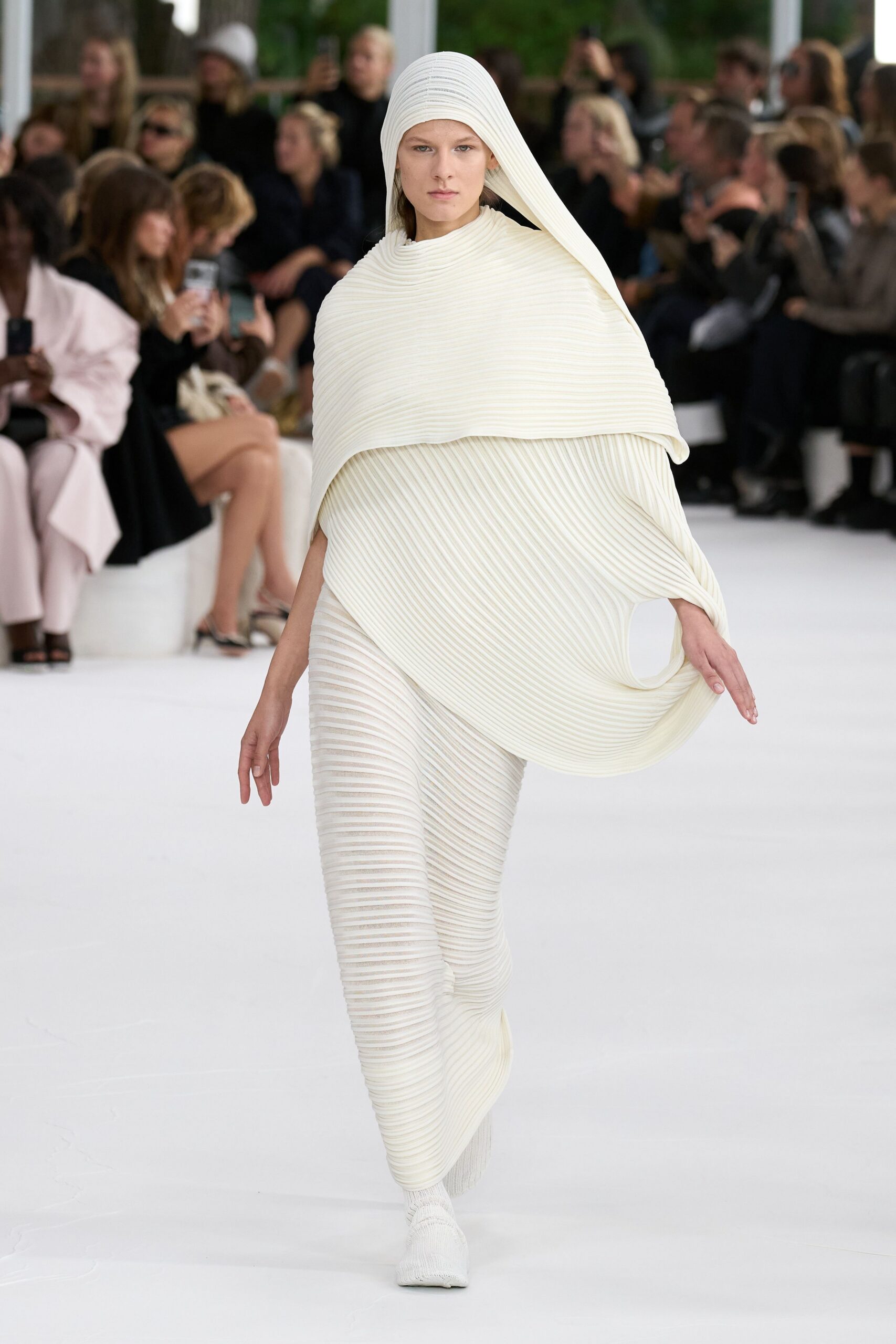 white pleated jumpsuit with hood