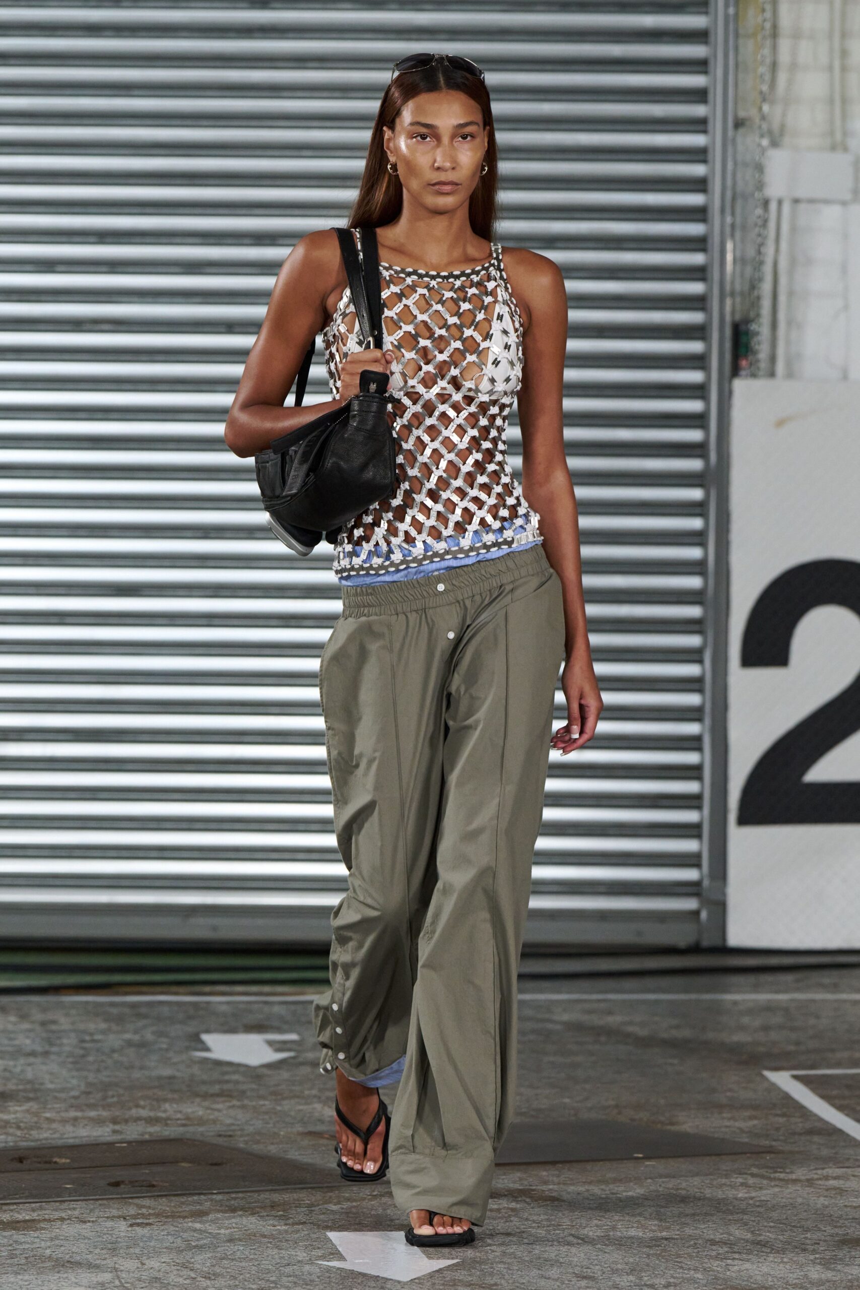 white crochet sleeveless top with cargo pants