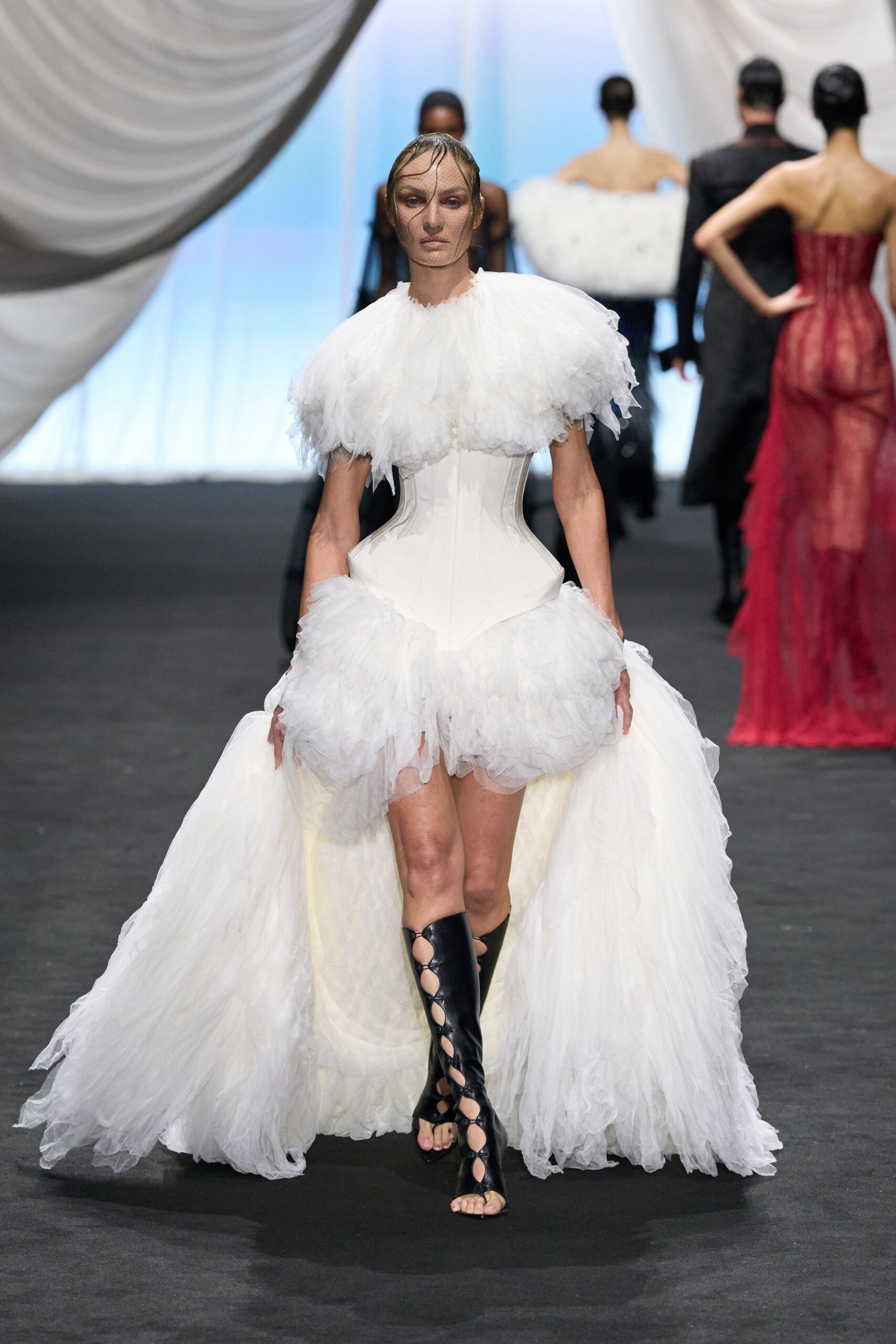 white ruffled gown with black boots